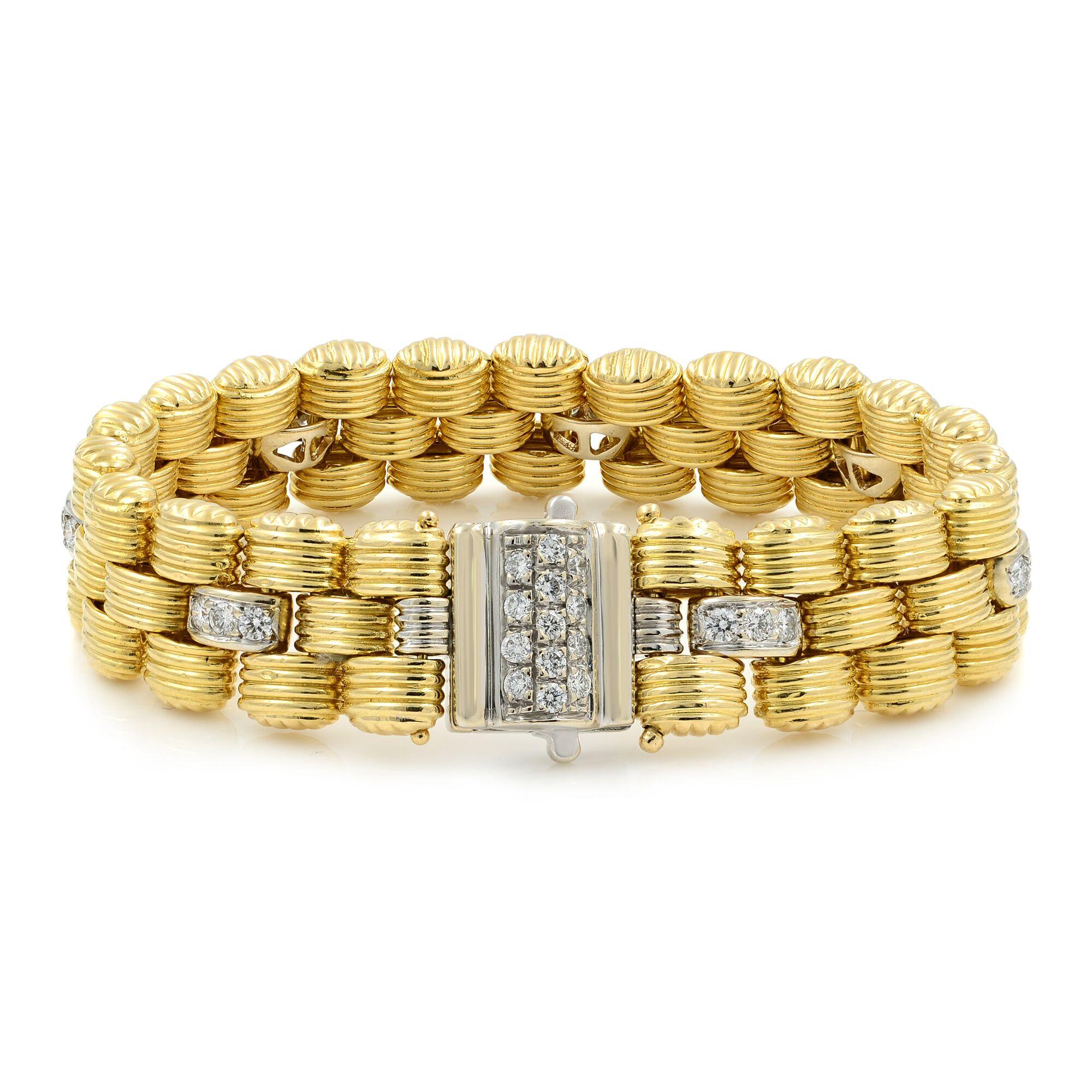 Vintage 18K Yellow Gold Link Bracelet with Diamonds. This unique link style bracelet is decorated with 34 round brilliant-cut diamonds, weighing a total of approximately 1.50cts. Each stone is prong set. 7 inches in length, approximately 14mm in