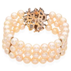 Pulsera vintage de oro amarillo y blanco de 14k con perlas y piedras preciosas