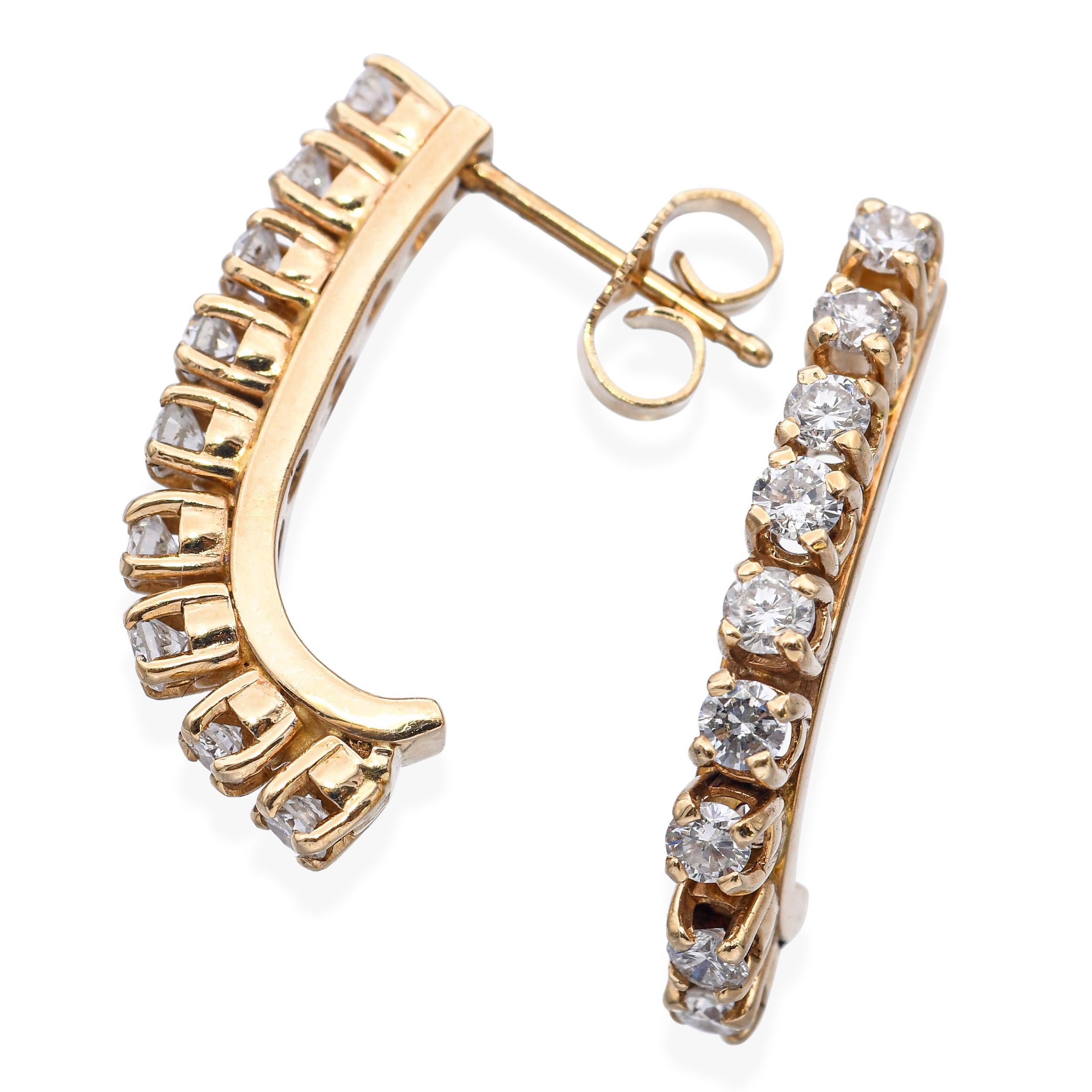 Estos pendientes vintage están elaborados en rico oro amarillo de 14k y engastados con un total de aproximadamente 0,75 quilates de diamantes talla brillante. Cada pendiente presenta un diseño atemporal y elegante, con diamantes centelleantes