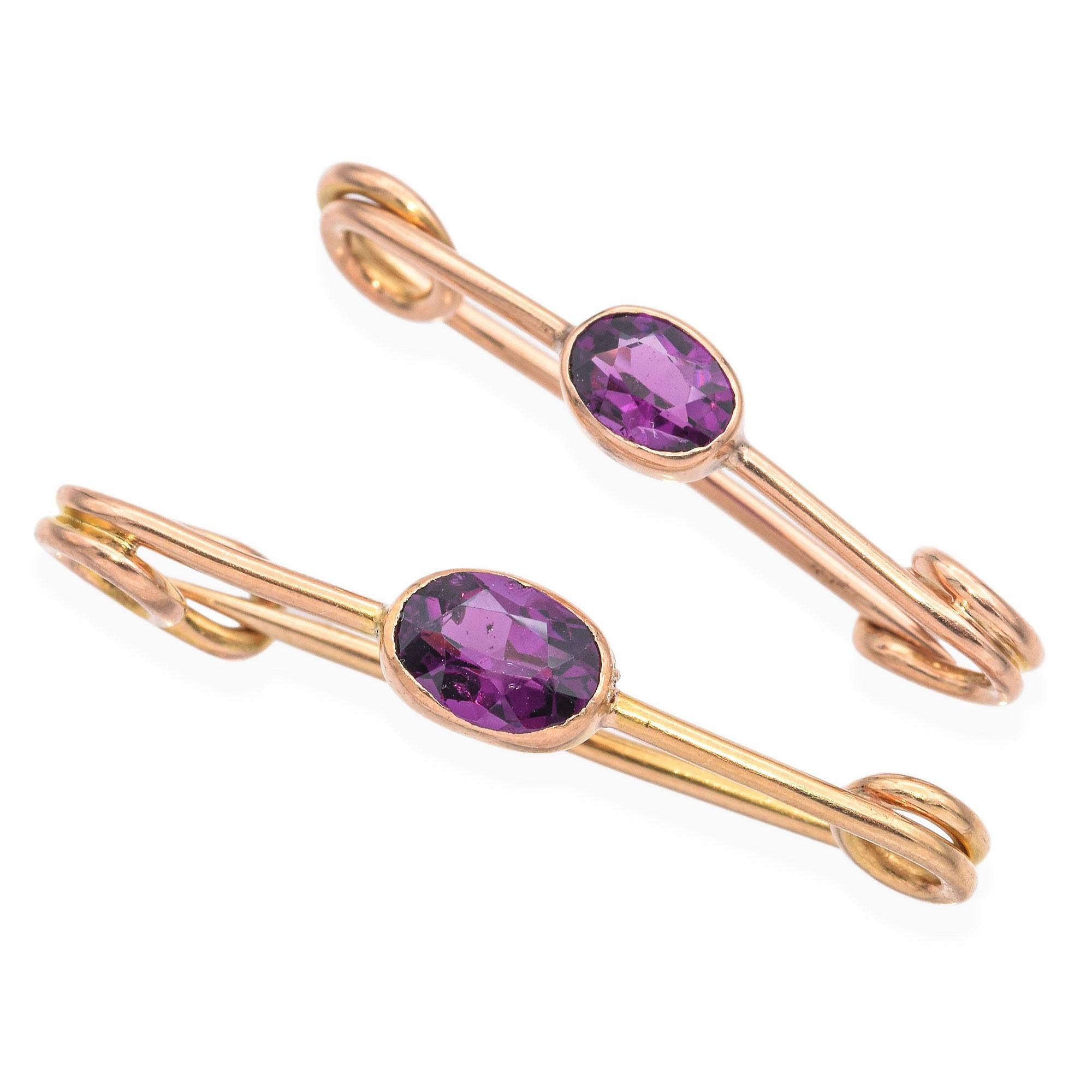 These elegant pins captivate with minimalist design and vibrant hues. Crafted in 14k yellow gold, each pin features a simple bezel set oval-cut purple rhodolite garnet allowing the rich color to take center stage.

Weight Pair: 2.7 Grams
Stone: 1.10