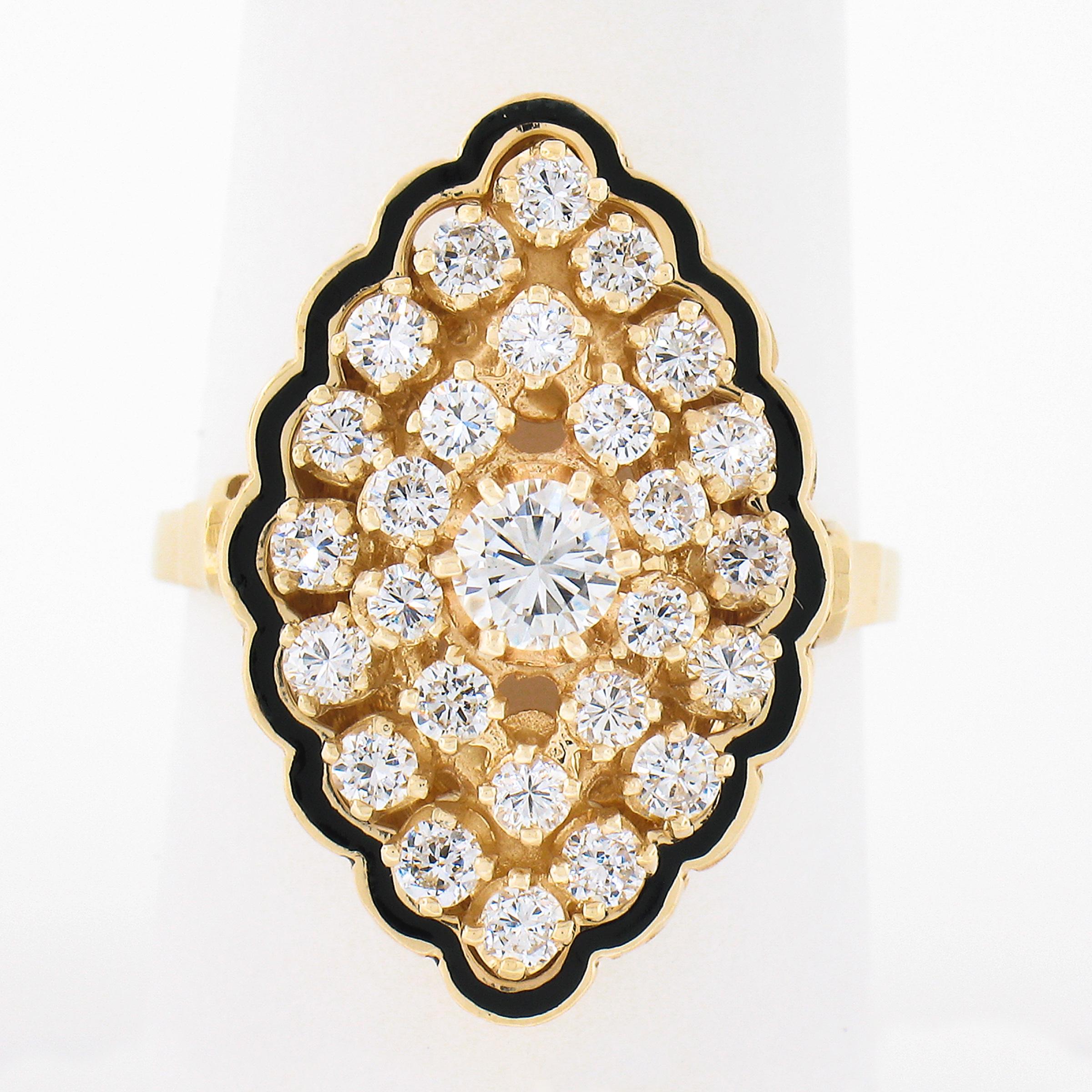 This absolutely stunning vintage diamond cocktail ring is crafted in solid 14k yellow gold and features a beautiful marquise shaped navette design, drenched throughout with approximaltey 1.12 carats of very fine quality round brilliant diamonds that