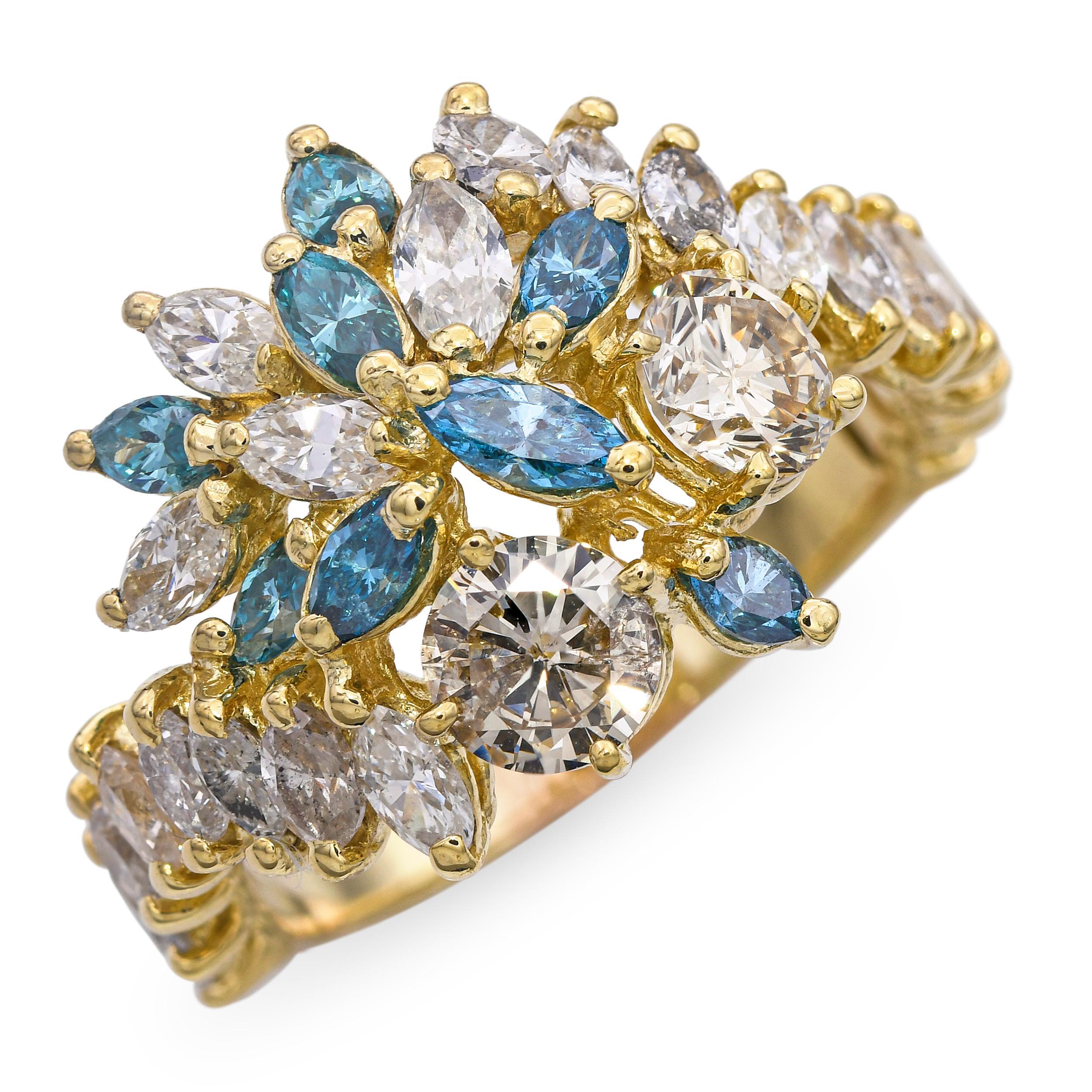 This vintage 14k yellow gold ring features a total of 1.74 carats of diamonds paired with 0.22 carats of enhanced blue diamonds, creating a striking blend of classic brilliance and vibrant color. The blue diamonds add a unique touch that stands out