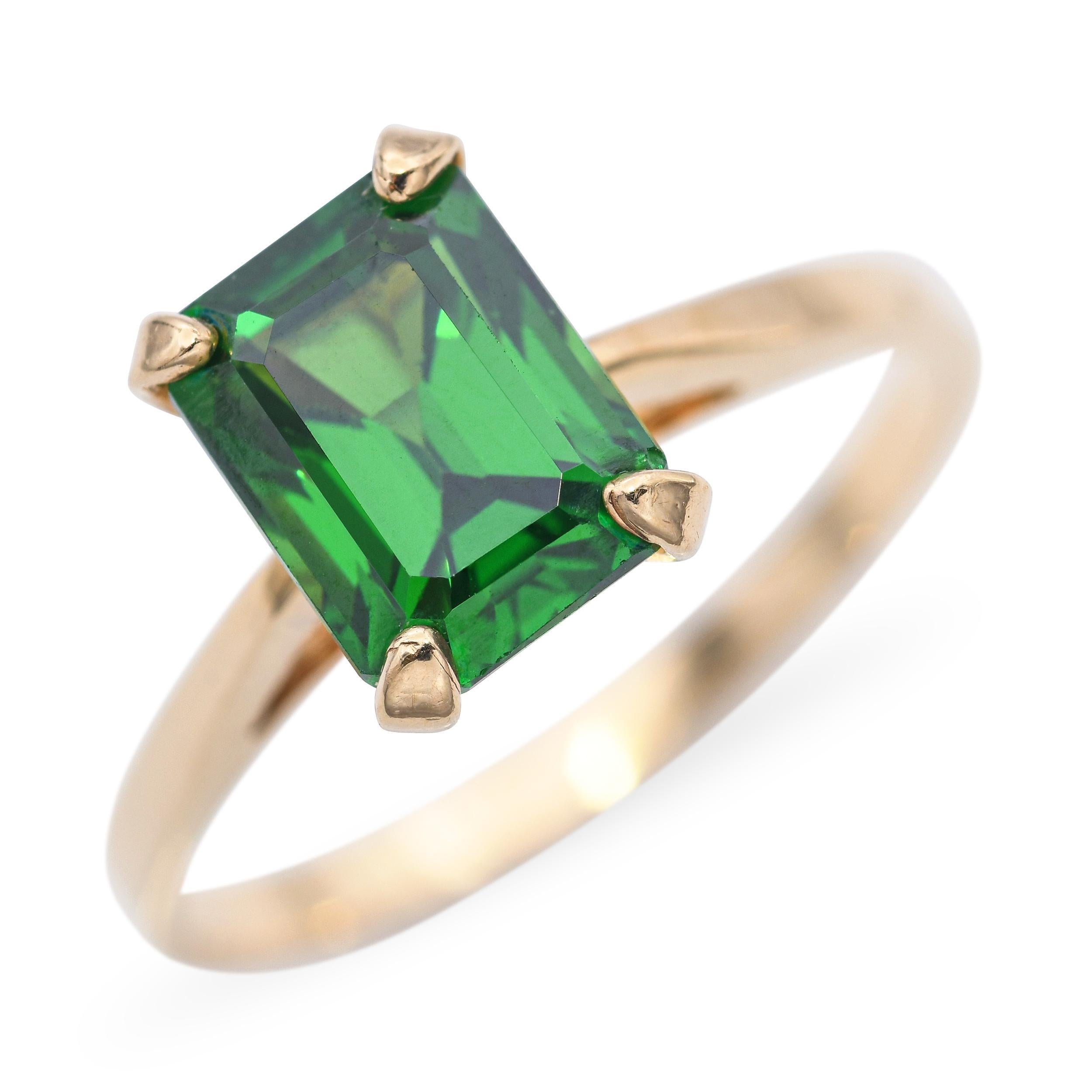 This striking vintage ring features a vibrant 2.12-carat chrome tourmaline set in warm 14k yellow gold, radiating a vivid, saturated green that commands attention. The rare gemstone exhibits exceptional clarity and depth of color, making it a