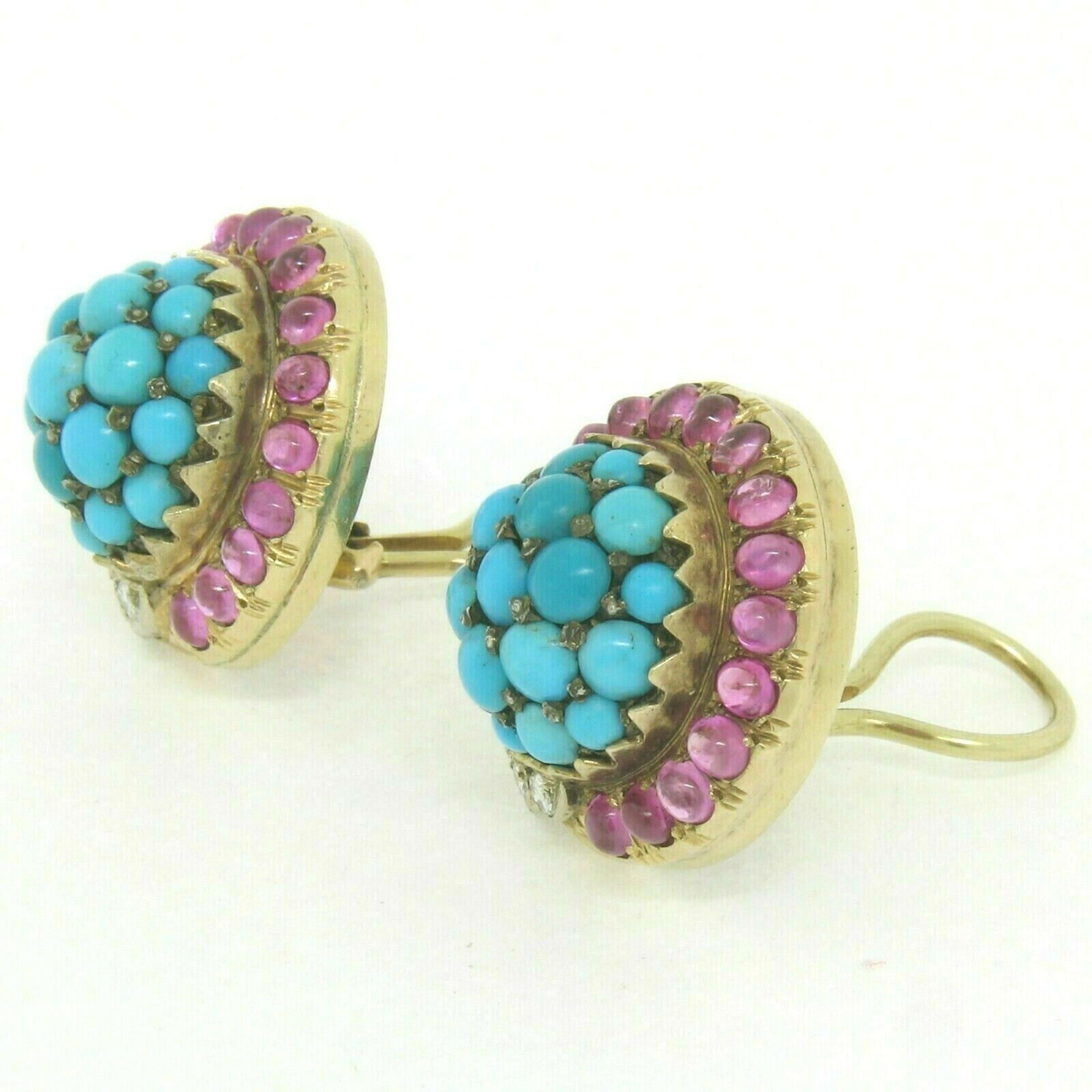 You are looking at a gorgeous vintage pair of turquoise, ruby, and diamond cluster earrings crafted in solid 14k yellow gold. There are 38 round cabochon turquoise stones which structure the center cluster of each earring. The center cluster is then