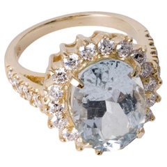 Anillo halo vintage de oro amarillo de 14 quilates con aguamarina ovalada y diamantes de 5,27 quilates