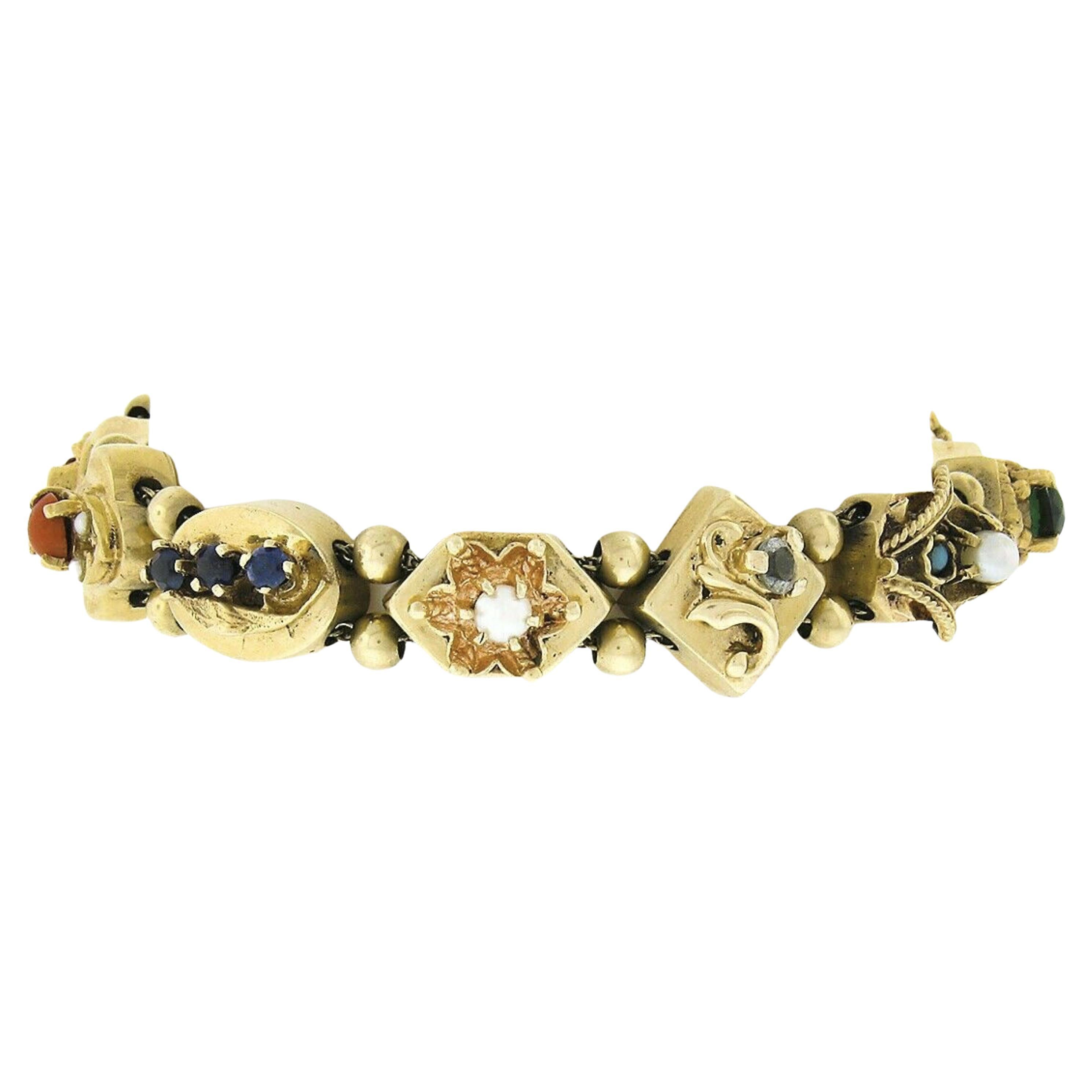 This gorgeous vintage slide bracelet was crafted from solid 14k yellow gold and features an incredibly unique design adorned with multiple gemstones throughout. The charms and polished gold beads slide freely on the dual cable link chains that run