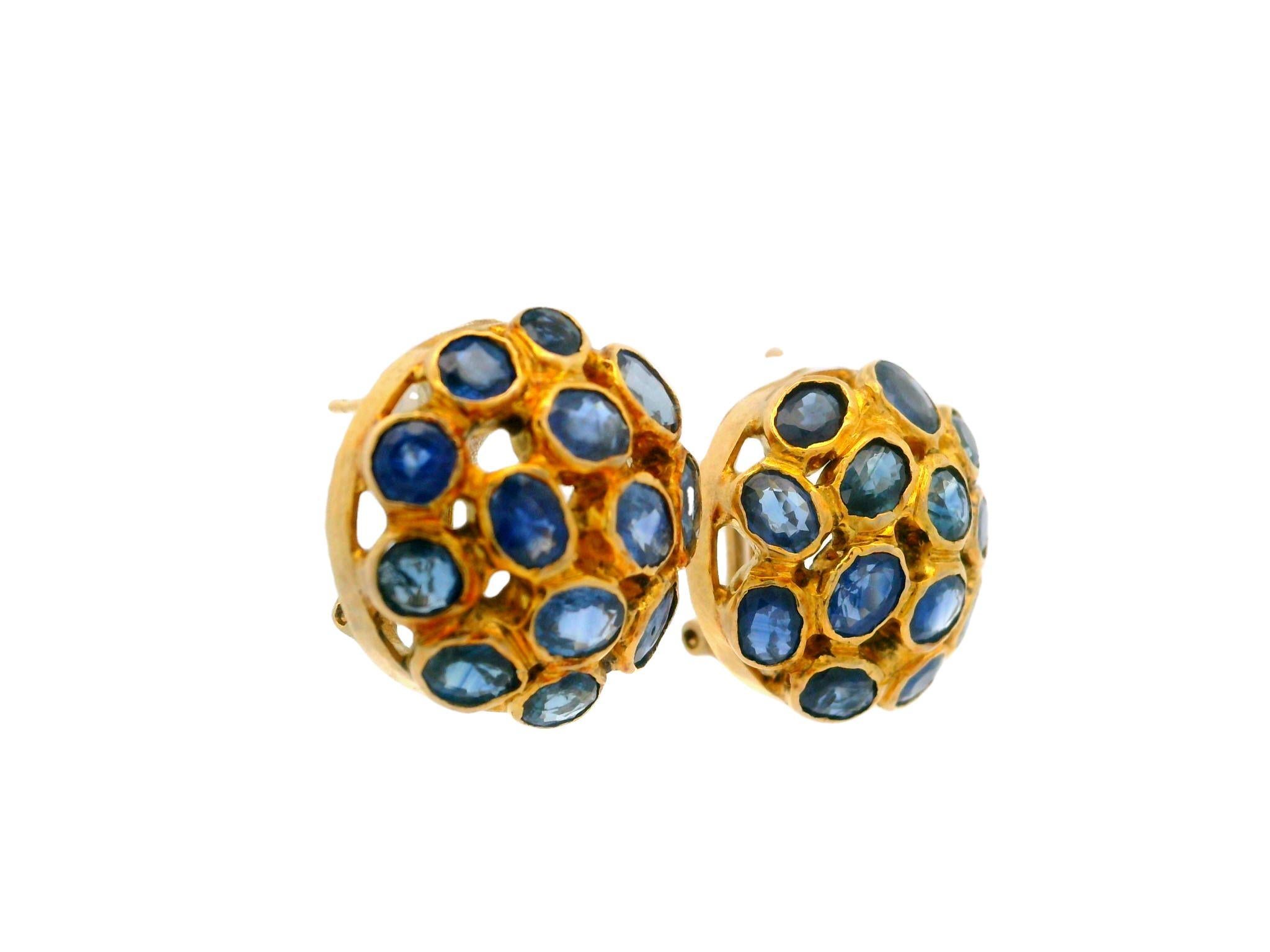 –Stone(s)–
(26) Natural Genuine Sapphire - Oval and Round Cut - Bezel Set - Medium Blue Color - 5-6ctw (approx.)

Material: 14k Yellow Gold
Weight: 6.81 Grams
Closure: Omega Back (Pierced ears are required.)
Overall Diameter: 15.84mm