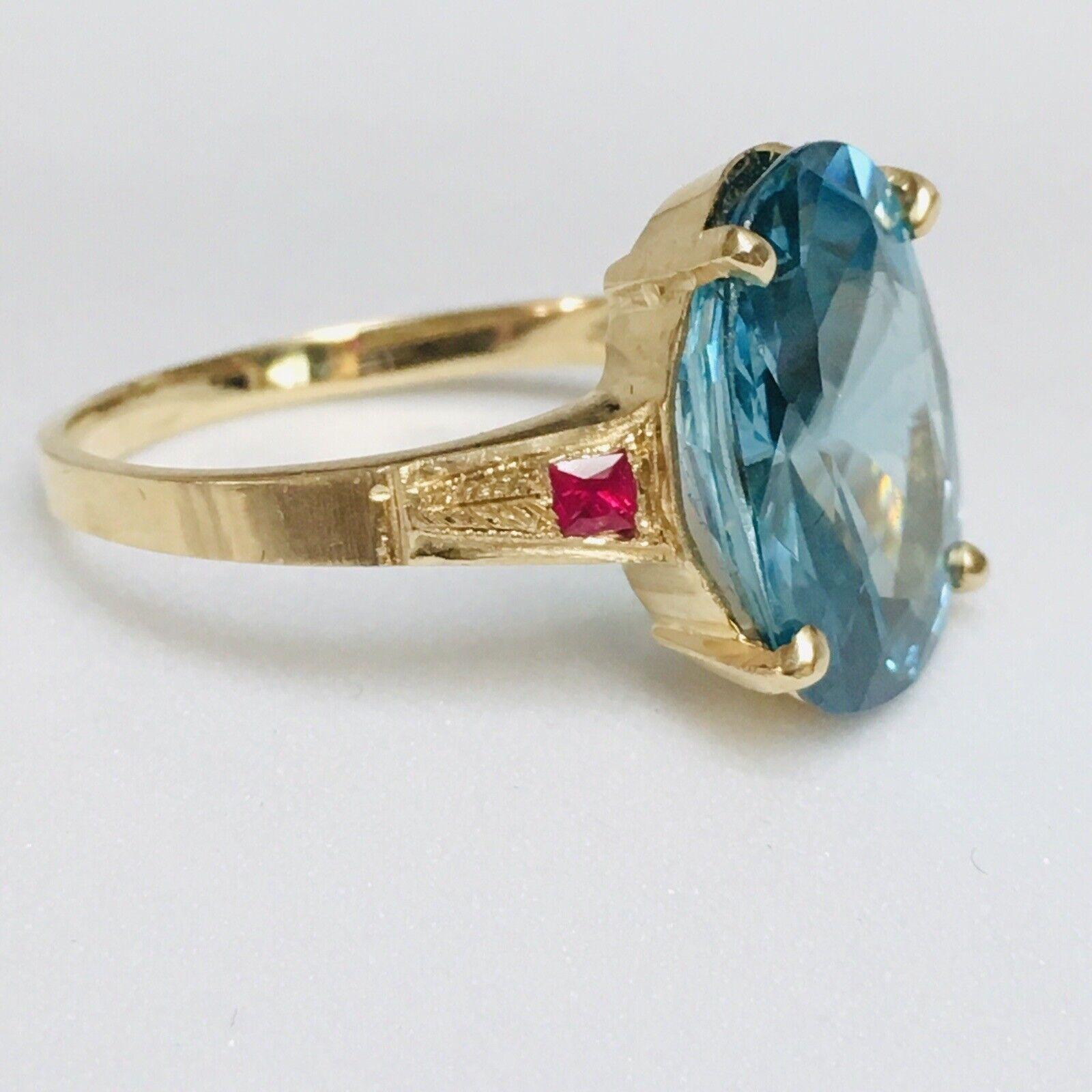 Vintage14k Yellow Gold 7.5 Carat Oval Faceted Blue Zircon Ring  

Finger Size: 7
Weight 4.2 gram
Center stone 13.9 mm by 10.4mm 5.8 mm … 7.5 Carat by measurements
Marked: 