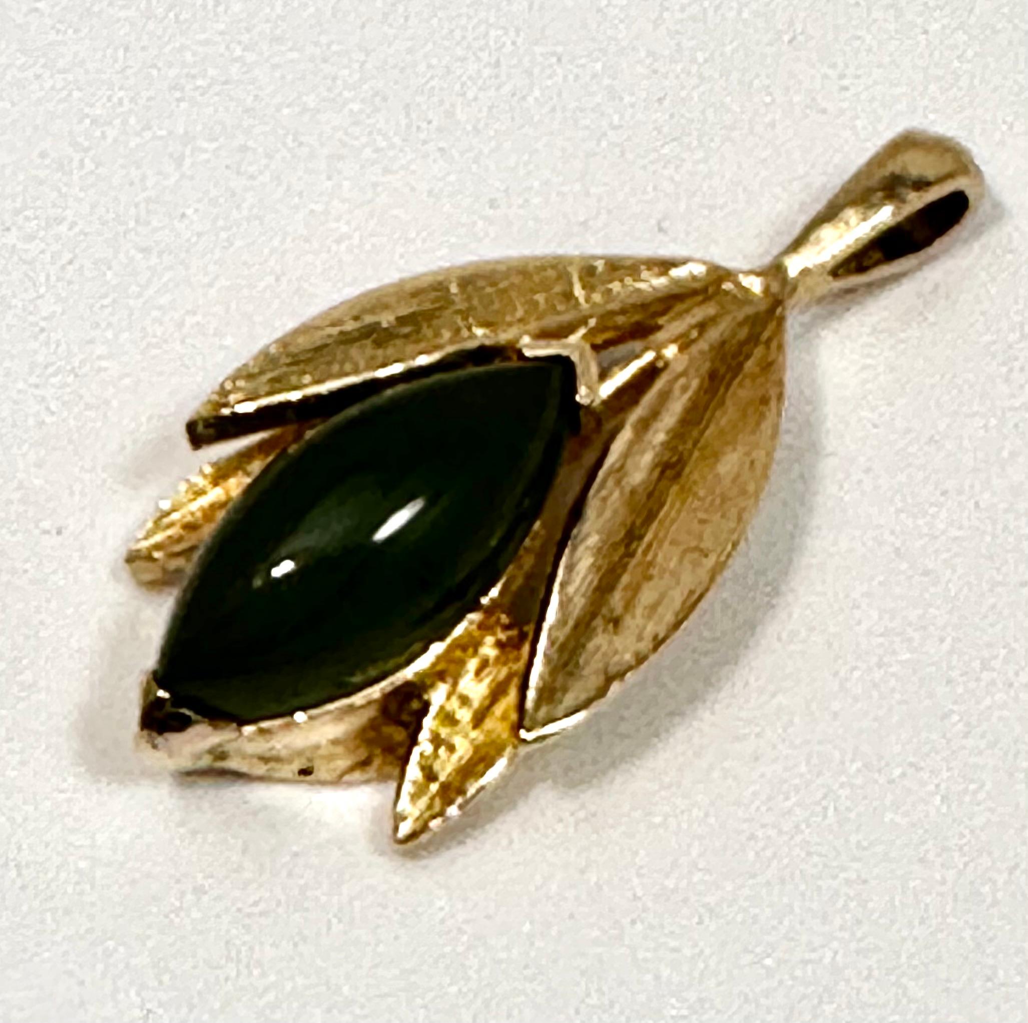Vintage 14k Yellow Gold 7mm x 14mm Marquise Shaped Green Jade Pendant
Pendant measures approx .55