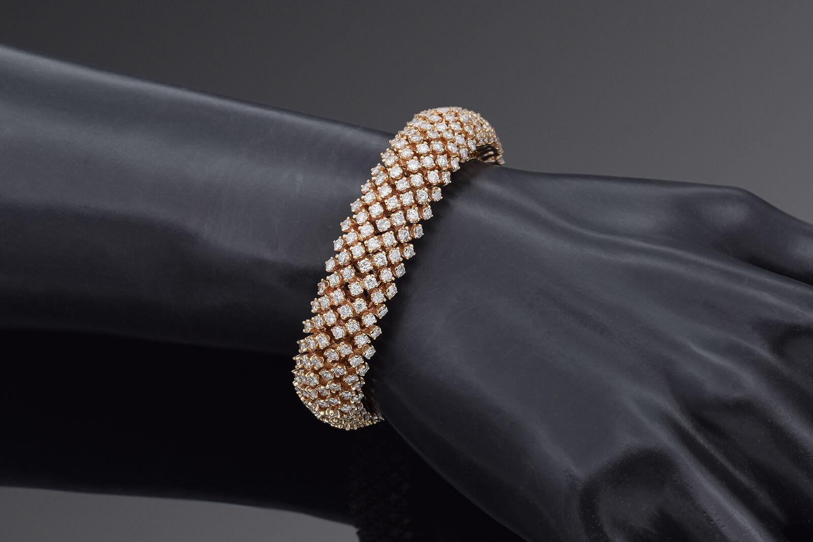 An amazing 14K yellow gold bracelet with 315 diamonds weighing 0.03ct each, totaling 9.45 total carat weight. The bracelet weighs 57 grams and measures 13.7mm wide. The bracelet length is 5.75 inches. Bracelet is stamped 14K.