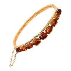 Bracelet jonc vintage en or jaune 14 carats et ambre