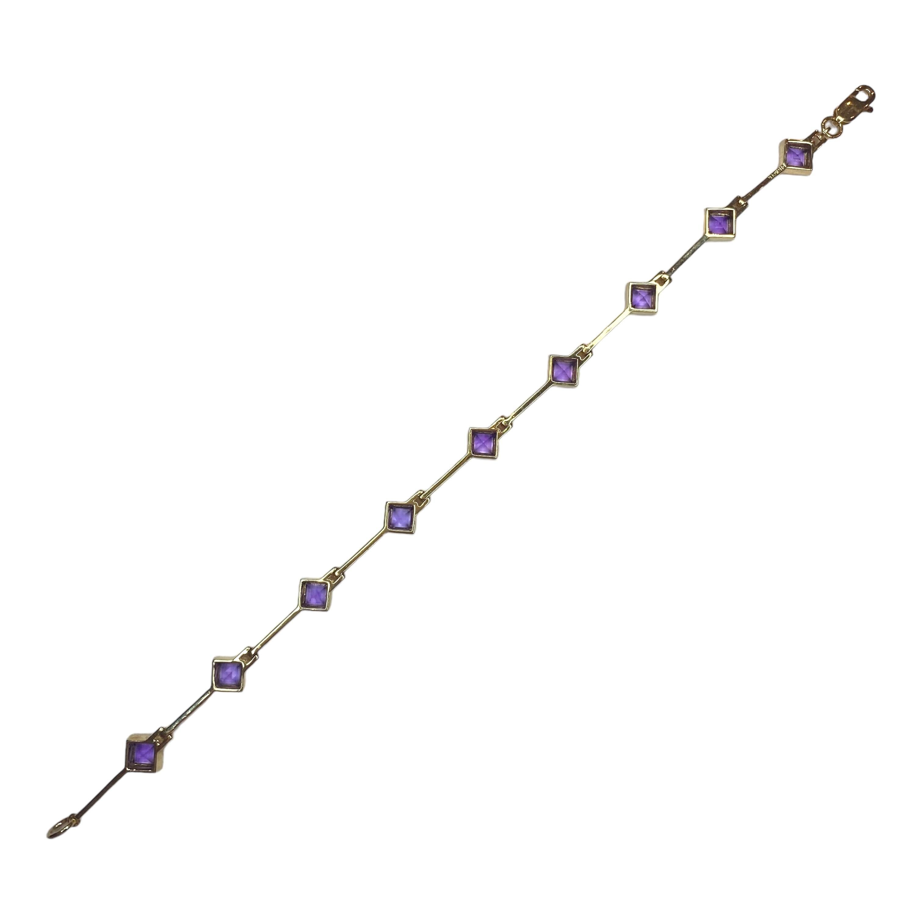 Crafted in 14K yellow gold, the bracelet features square cut bezel set amethyst solitaire connected by gold bars. Bright polish finish and lobster claw clasp.
9 Amethyst: 3.00ctw
Measurements:
Length: 7.5 inches
Width: 0.3 inch (7.8 mm)
Weight: 9.9
