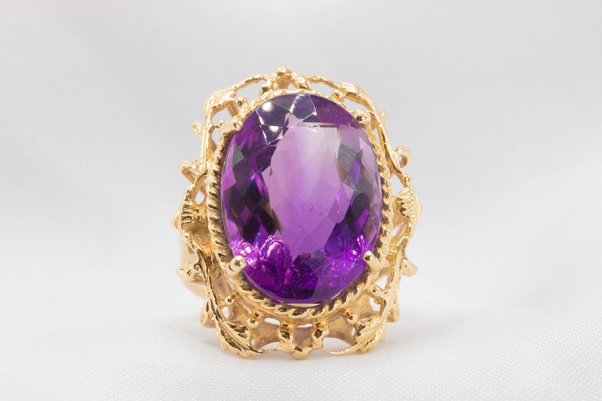 Vintage 14K Yellow Gold Oval Amethyst Cocktail Ring 

This stunning vintage cocktail ring is expertly crafted in 14K yellow gold and showcases a captivating oval amethyst measuring approximately 19.2 x 13.6mm. The unique setting beautifully