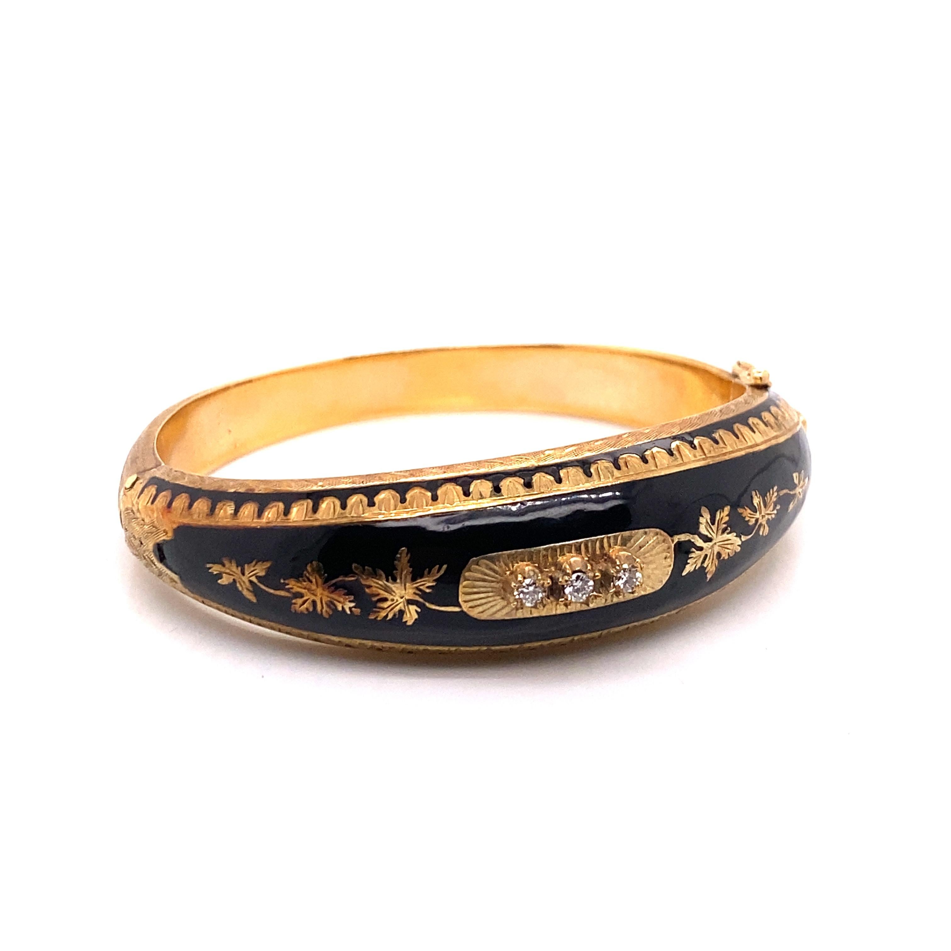 Vintage 14K Yellow Gold and Black Enamel Bangle with 3 Diamonds - The bangle is 17.5mm wide on top and tapers down to 7.7mm on the bottom. The bangle features a 6 leaf design and hand engraving. The 3 round diamonds weigh about .15ct total with G -