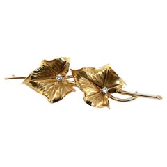 Broche vintage en or jaune 14k et feuille de diamant