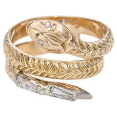 Anello a spirale con diamante baguette in oro giallo 14k vintage