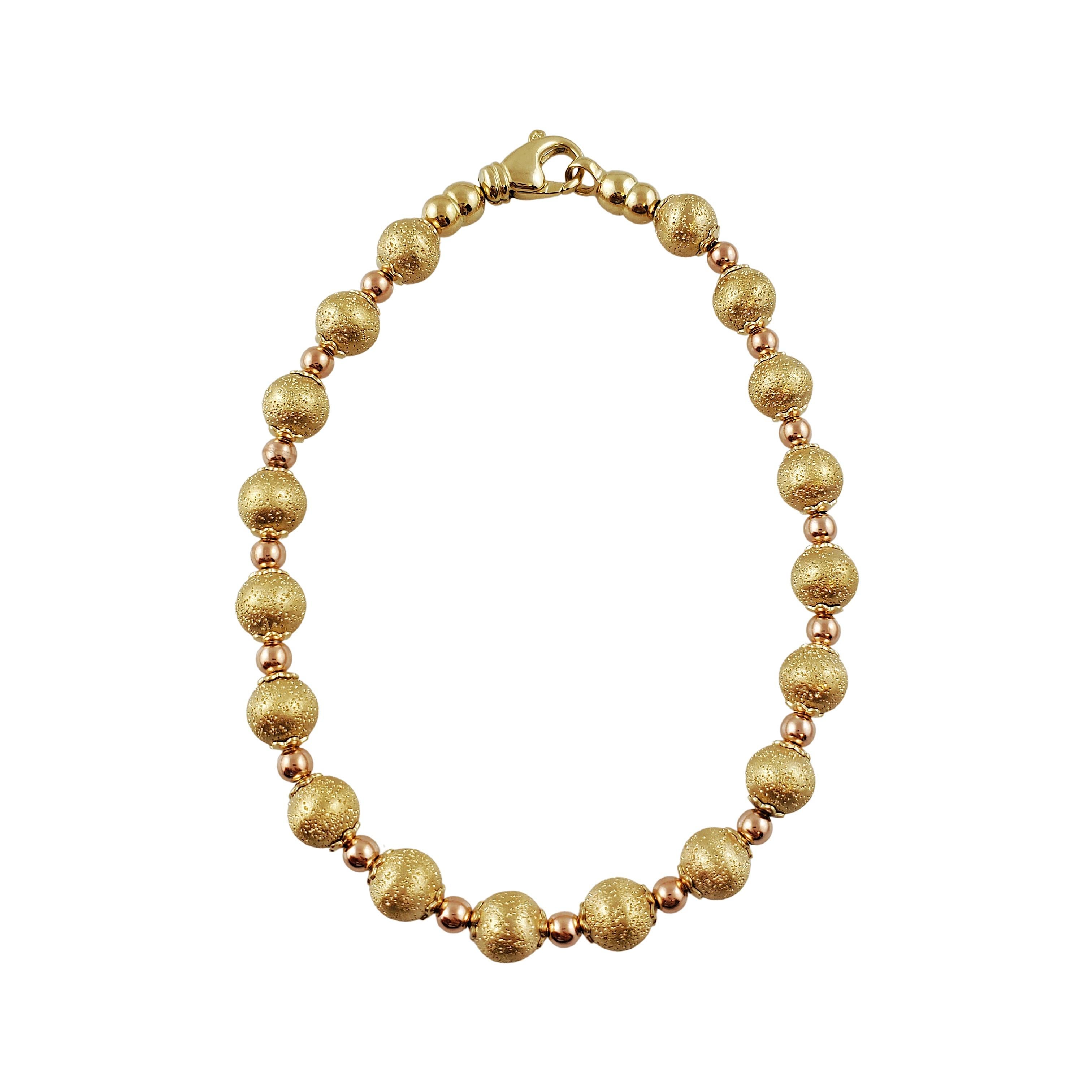 Vintage 14K Gelbgold Kugelarmband

Wunderschönes Kugelarmband mit einzigartiger Textur auf den größeren Kugeln und scheinbar Roségold auf den kleineren Kugeln. Dieses Armband ist aus 14k gefertigt und besteht hauptsächlich aus Gelbgold mit einem