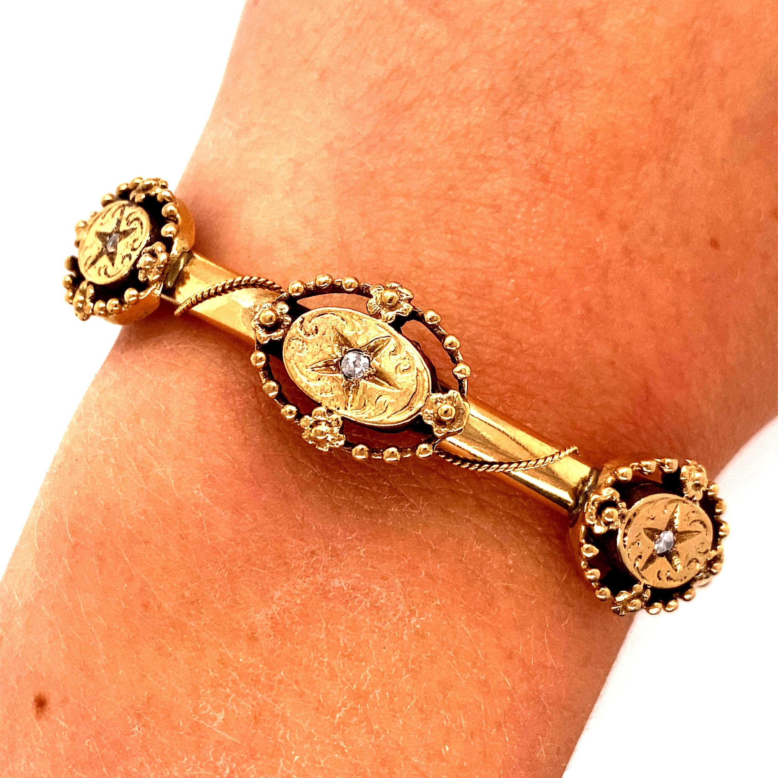 Vintage 14K Yellow Gold Bangle Bracelet - The bangle has three filigree engraved sections with diamond chips in the middle that are 18mm long and 13.5mm wide. The width of the bracelet is 4.7mm. The inside diameter is 2 inches high and 2.25 inches