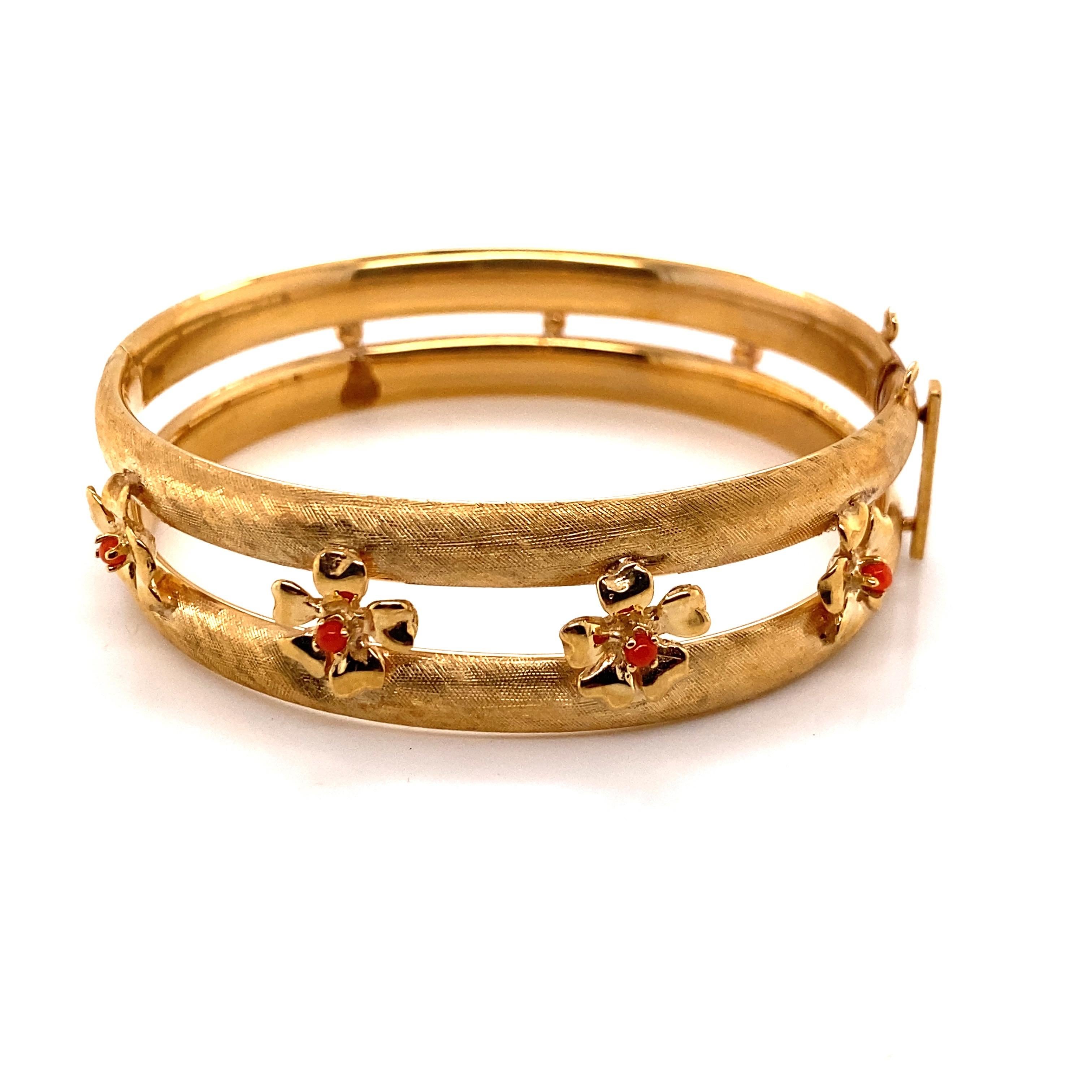 Vintage 14K Yellow Gold Bangle Bracelet with Coral Flower Designs - The bangle measures 17.3mm wide on the top and 14.6mm on the bottom. The inside diameter is 2 inches high and 2.2 inches wide. The bracelets weigh is 18.65 grams.