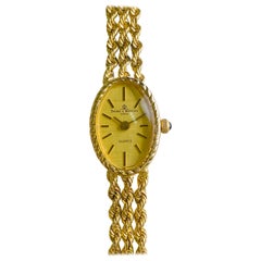 Baume et Mercier Montre vintage en or jaune 14 carats