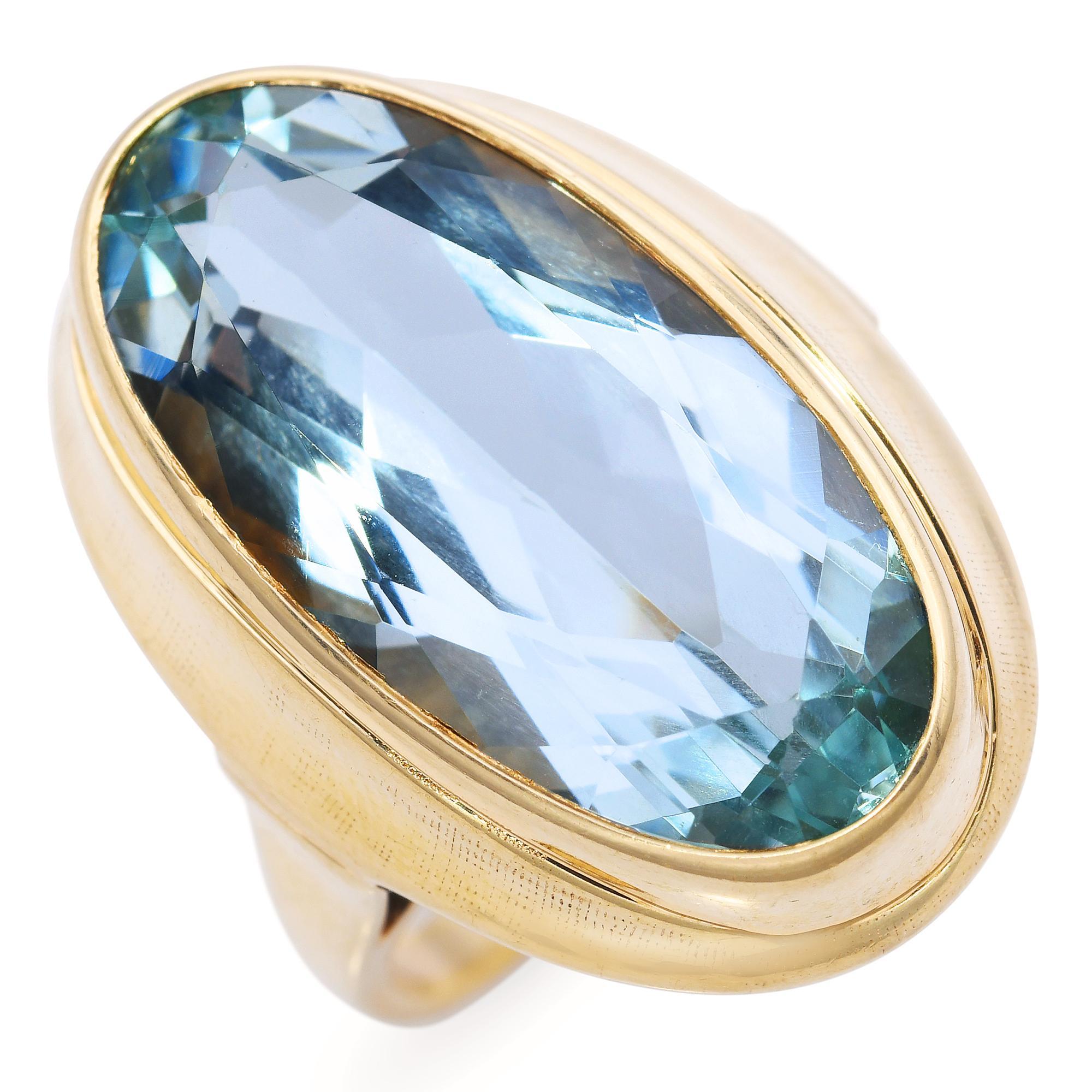 This vintage ring features a serene aquamarine gemstone, bezel-set in rich 14k yellow gold for a clean, timeless silhouette. The soft blue hue of the aquamarine evokes calm and clarity, beautifully complemented by the warm glow of the gold. Its