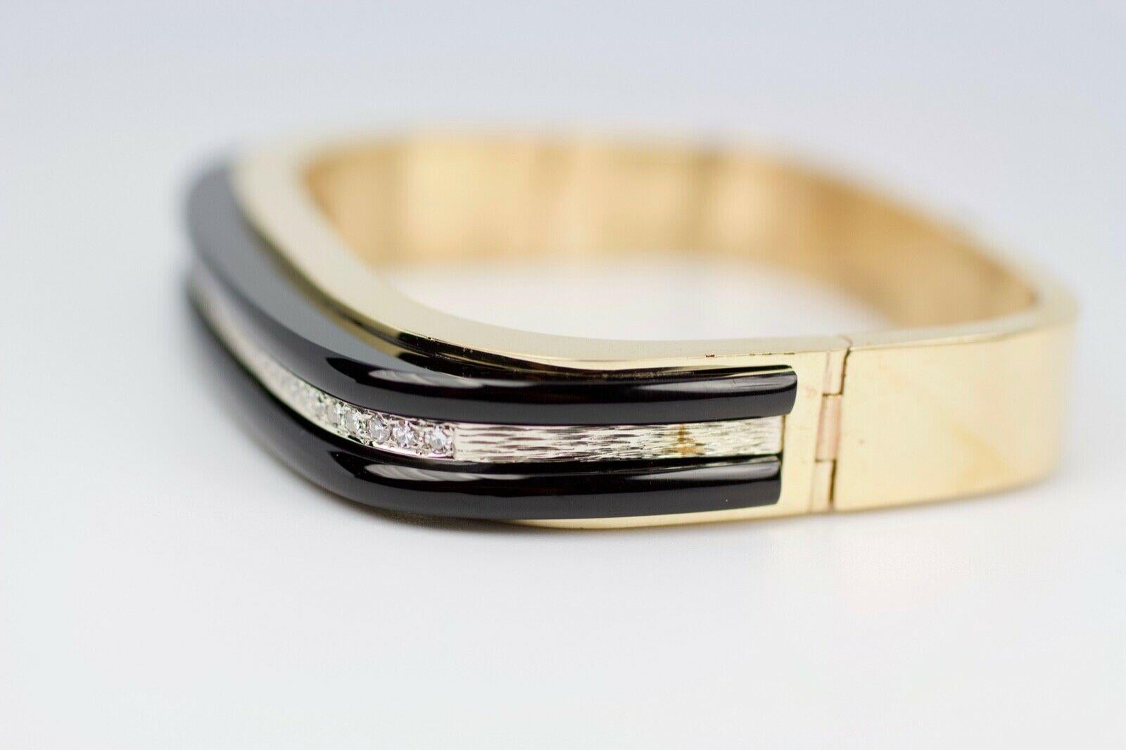 14k Yellow Gold Black Onyx And Round Single Cut Bangle
47.5 Grams
7 inches 
This is a beautiful 14k Yellow gold Bangle. This is a stunning vintage piece in great condition. If you have any questions or concerns please message me and I will get back