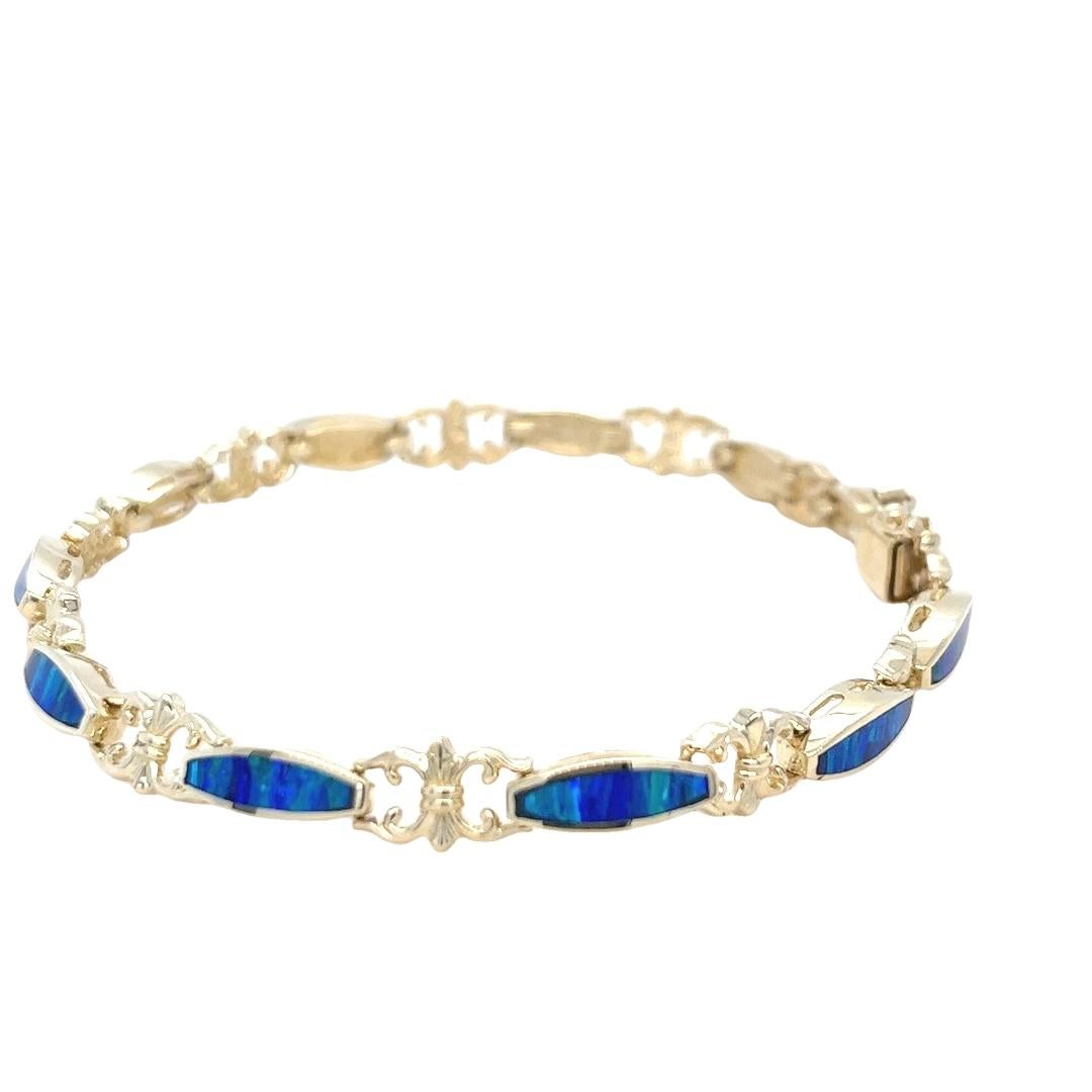 Pulsera vintage de oro amarillo de 14 quilates con incrustaciones de ópalo azul y verde Corte oval en venta