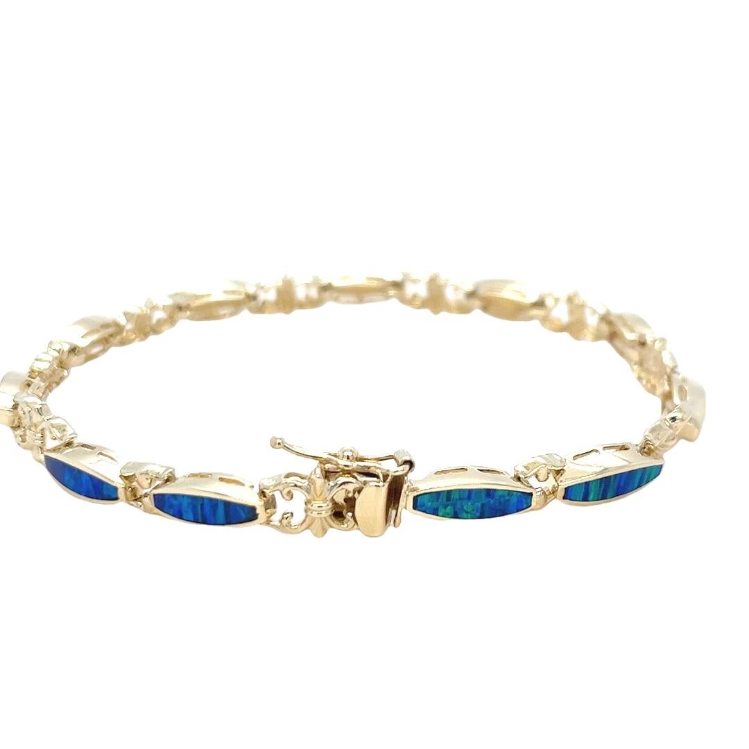 Pulsera vintage de oro amarillo de 14 quilates con incrustaciones de ópalo azul y verde en Bueno estado para la venta en Coral Gables, FL