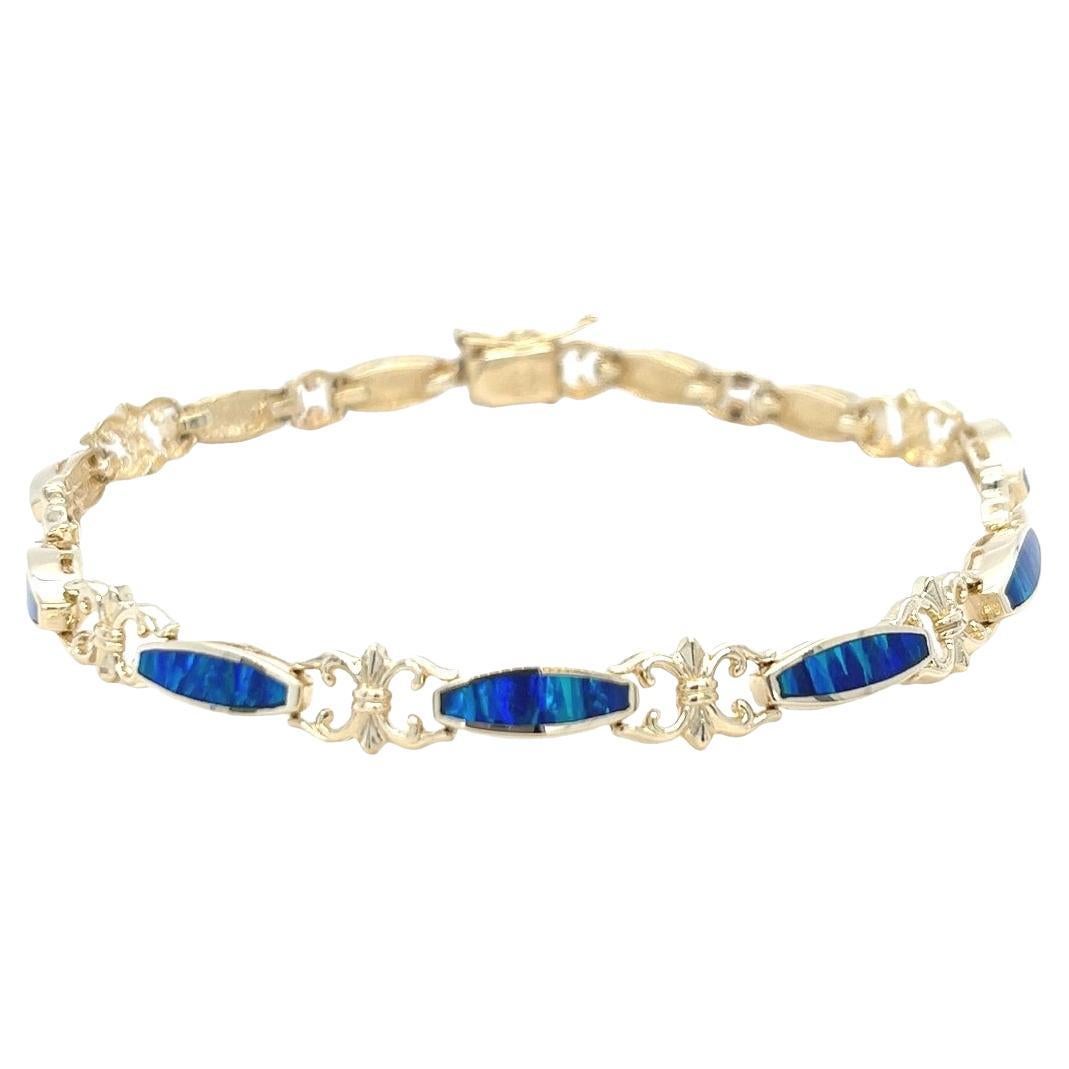 Pulsera vintage de oro amarillo de 14 quilates con incrustaciones de ópalo azul y verde en venta