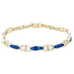 Pulsera vintage de oro amarillo de 14 quilates con incrustaciones de ópalo azul y verde