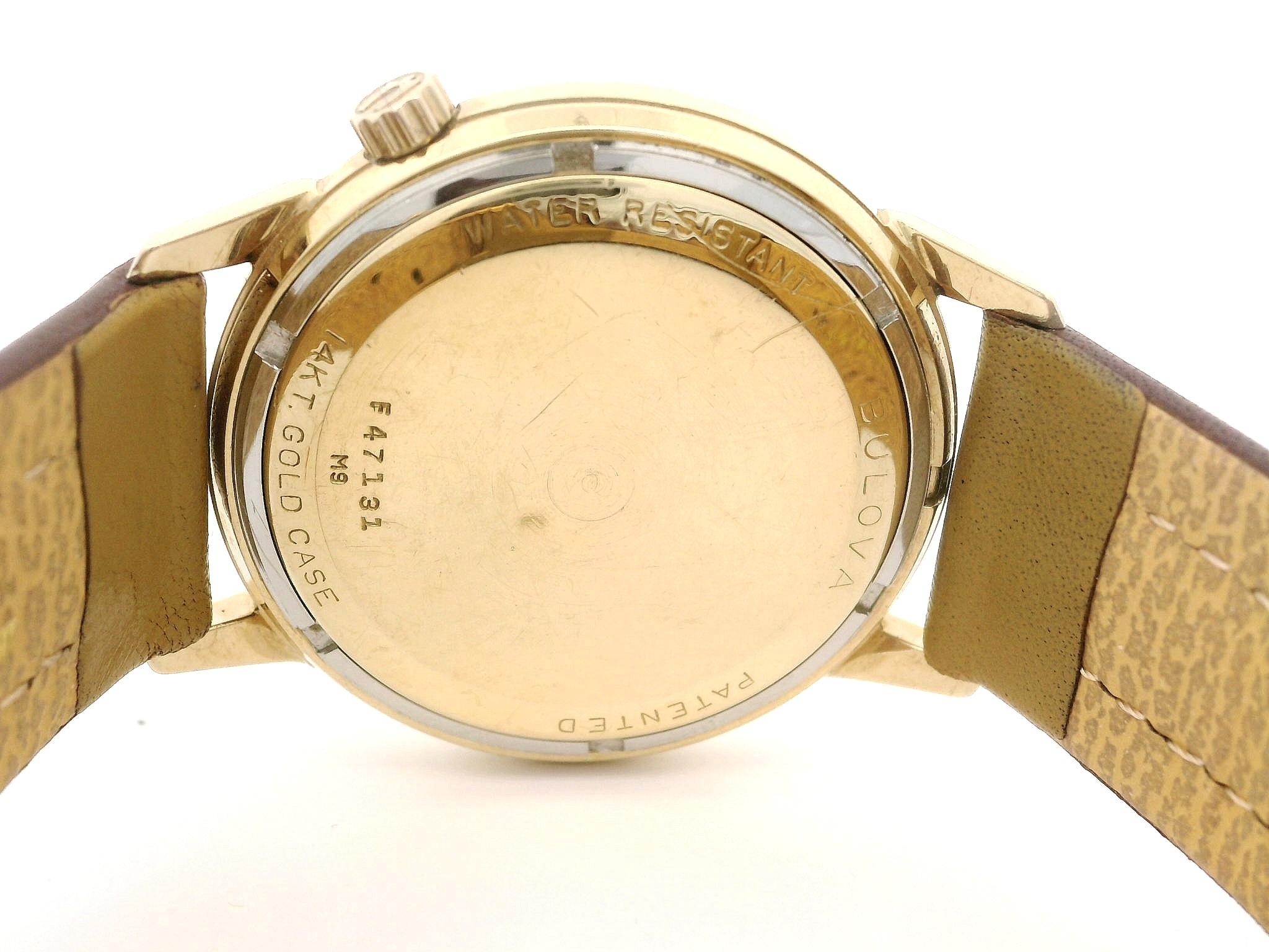 Vintage 14k Yellow Gold Bulova Accutron 34mm Date Quartz Wrist Watch Ref. M9 For Sale 7