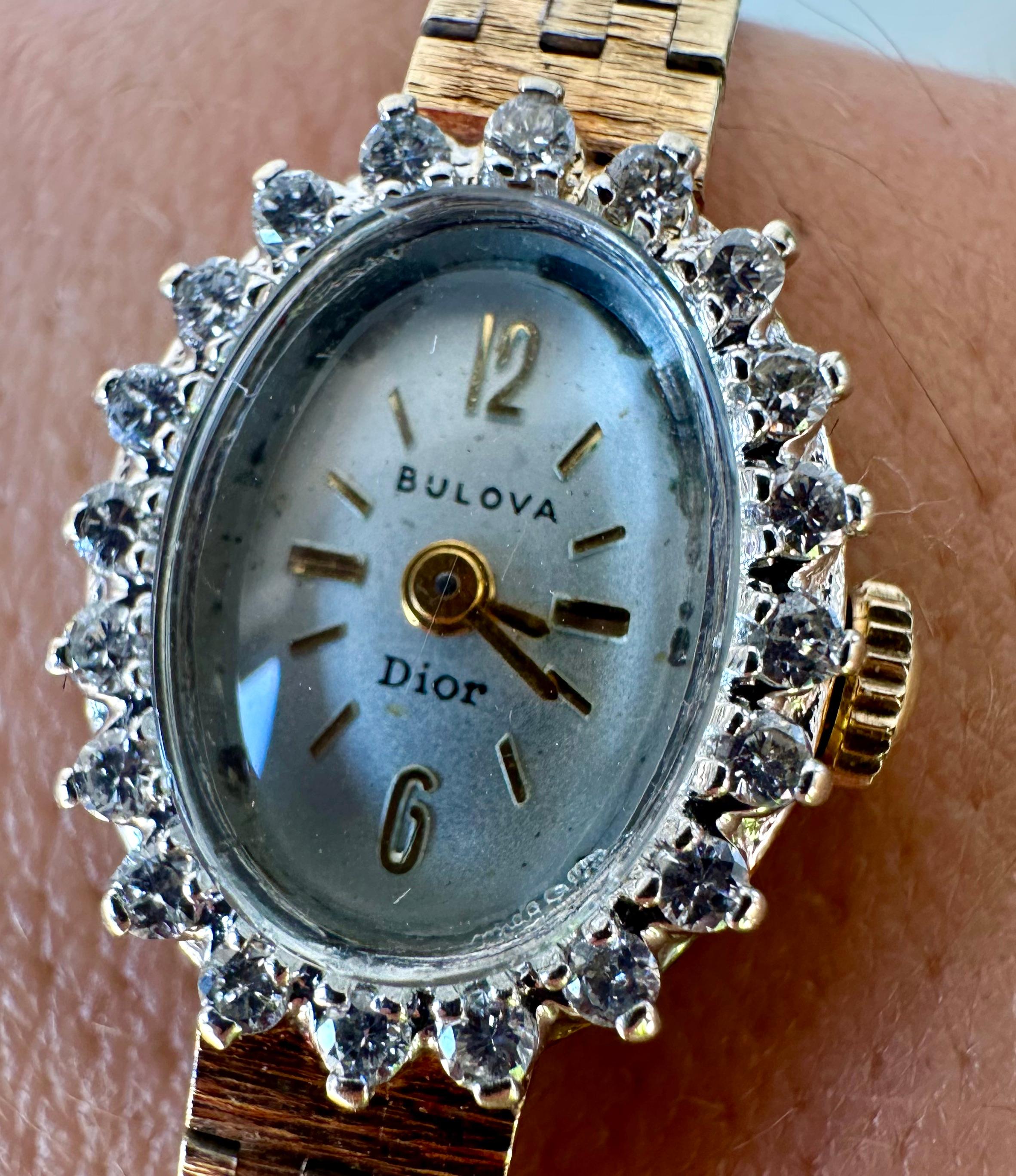 Beautiful pre-owned rare vintage Bulova Dior watch in 14K yellow gold, weighing 19.1 grams. This elegant timepiece features a 17mm case with a 6.9mm thickness and a 6.3mm band width, fitting up to 6.5 inches and adjustable. It has a smooth-running