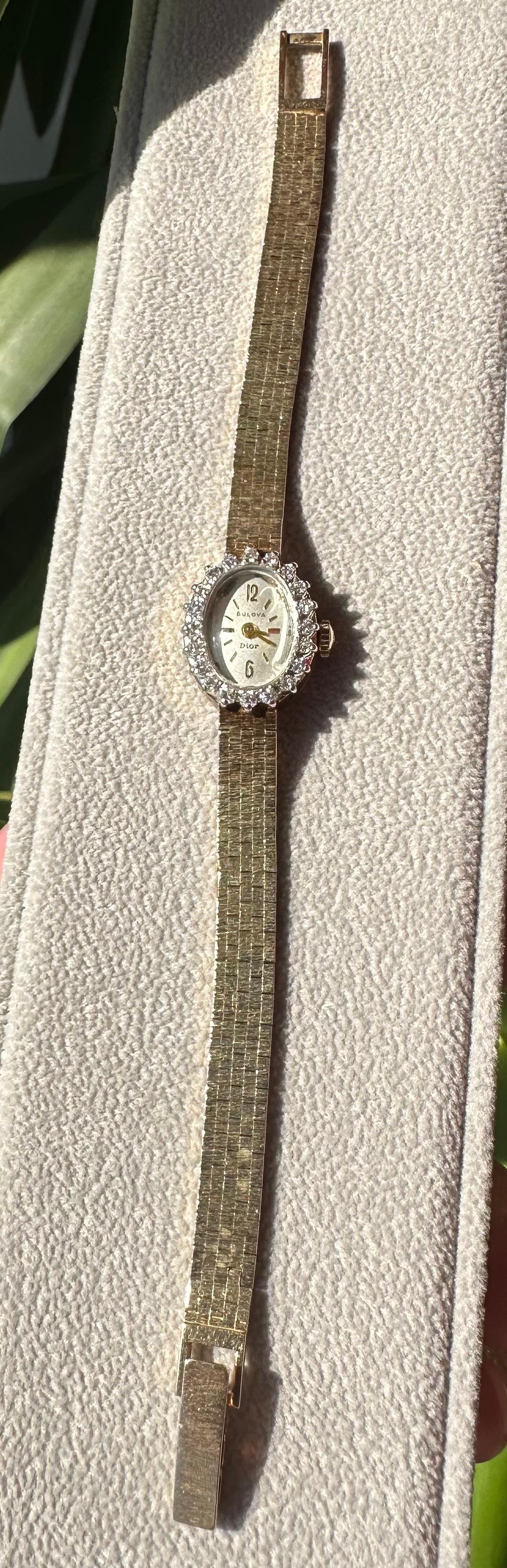 Women's Vintage 14k Yellow Gold Bulova Dior Watch with a Diamond Bezel