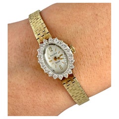 Vintage 14k Yellow Gold Bulova Dior Watch with a Diamond Bezel