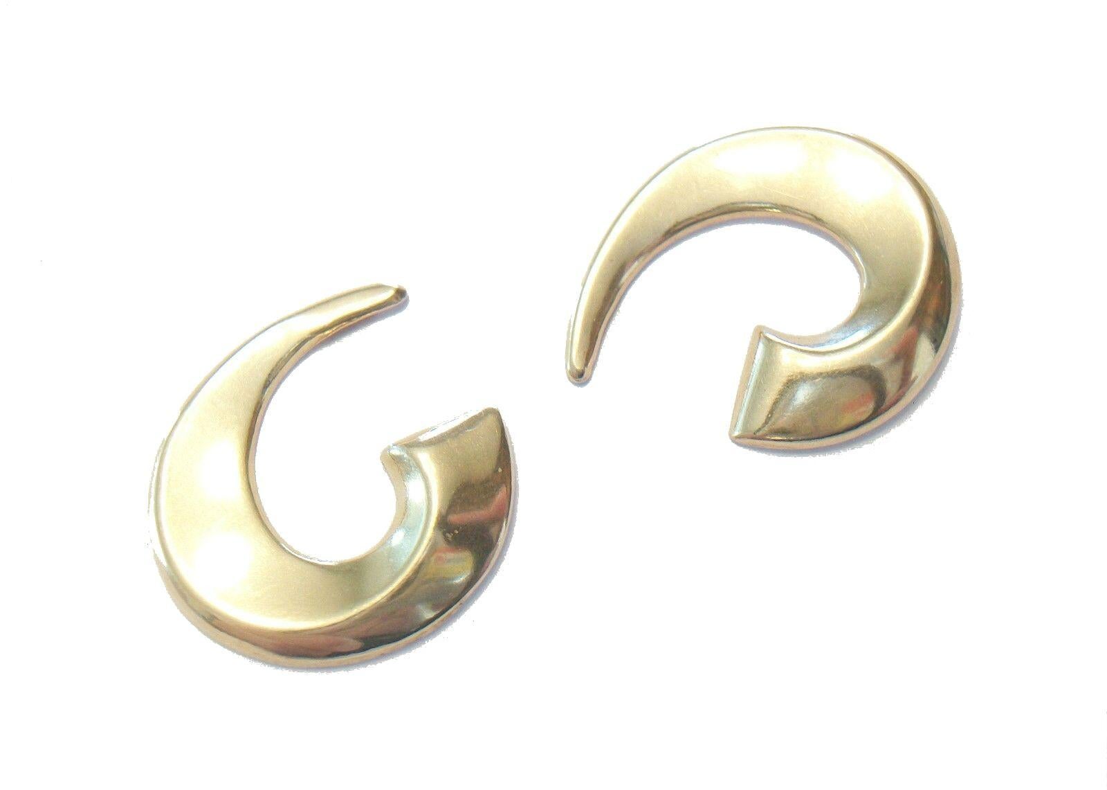 Vintage 14 K yellow gold earrings - three dimensional 'C' scroll shape - post backs for pierced ears with original butterfly backs - each signed B Y (including butterfly backs) - each stamped 14 K (including butterfly backs) - United States (likely)