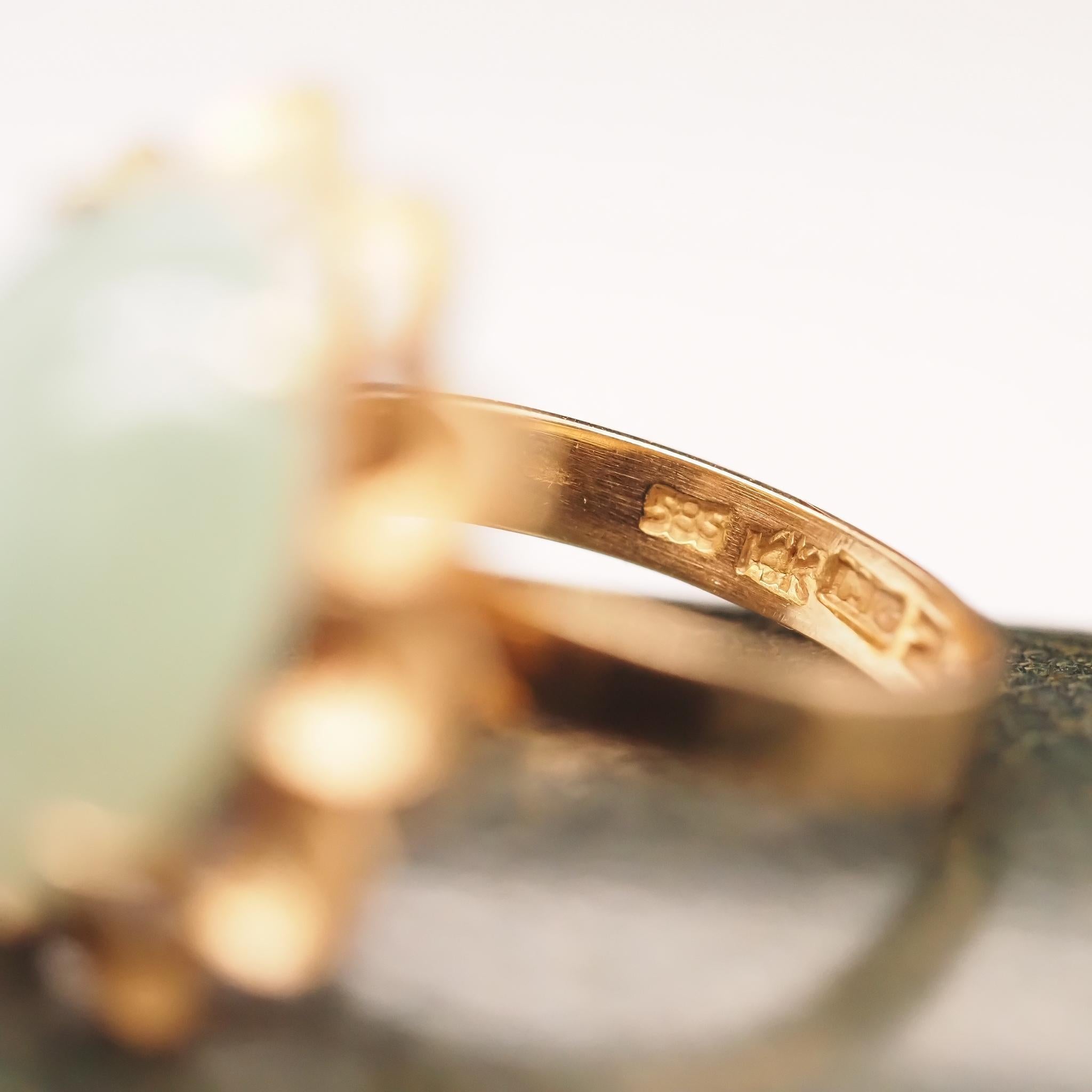 Year: 1970s
Item Details:
Ring Size: 7 (Sizable)
Metal Type: 14K Yellow Gold [Hallmarked, and Tested]
Weight: 7.7 grams
Jade Details: 18.1mm x 13.1mm
Band Width: 3.5mm
Condition: Excellent