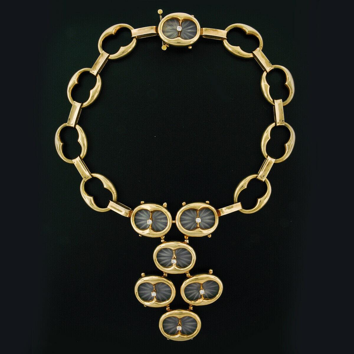 This large vintage statement piece was very well crafted from solid 14k yellow gold and features numerous pieces of etched camphor glass accented by top quality diamonds throughout. The necklace is structured from solid, open, oval shaped links that