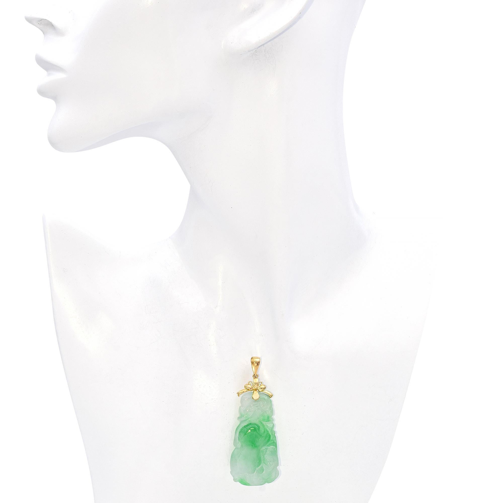 This exquisite vintage pendant highlights a beautifully carved green jade, radiating a serene translucence that captures the essence of elegance and tranquility. Known for its symbolic associations with prosperity, wisdom, and protection, the jade’s