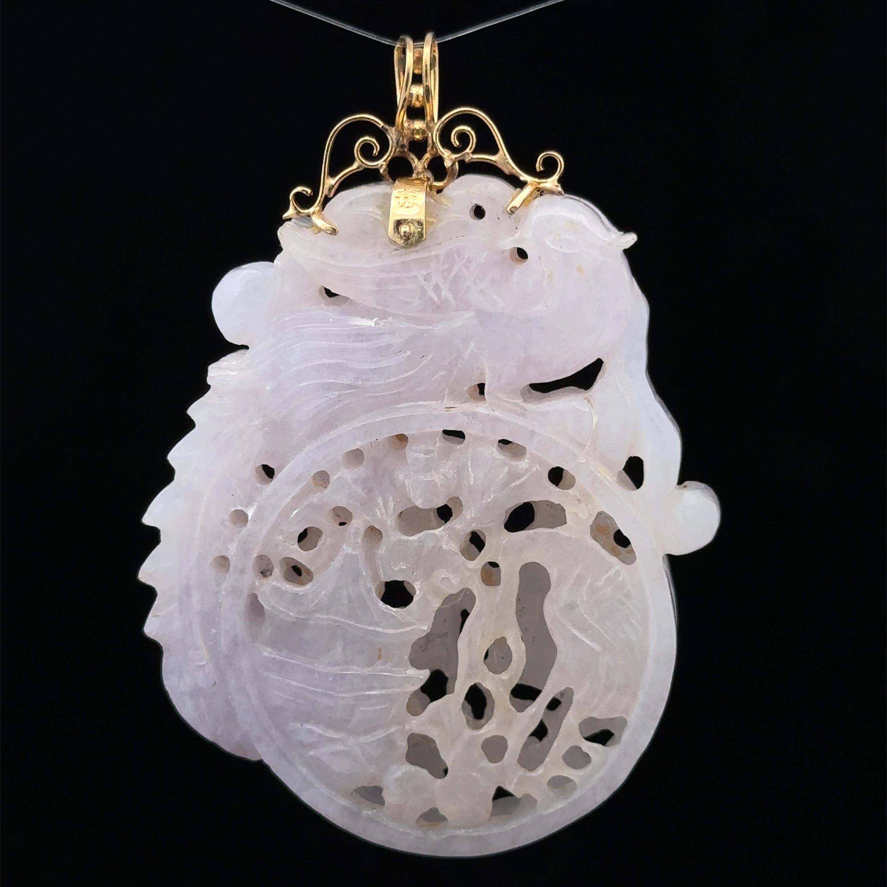--Stone(s):--
(1) Natural Genuine Jade - Carved Phoenix, Crane, House, Floral Scene - Soft Lavender Color 

Material: 14k Solid Yellow Gold Bail
Weight: 41.6 Grams
Overall Height: 67.72mm (2.66