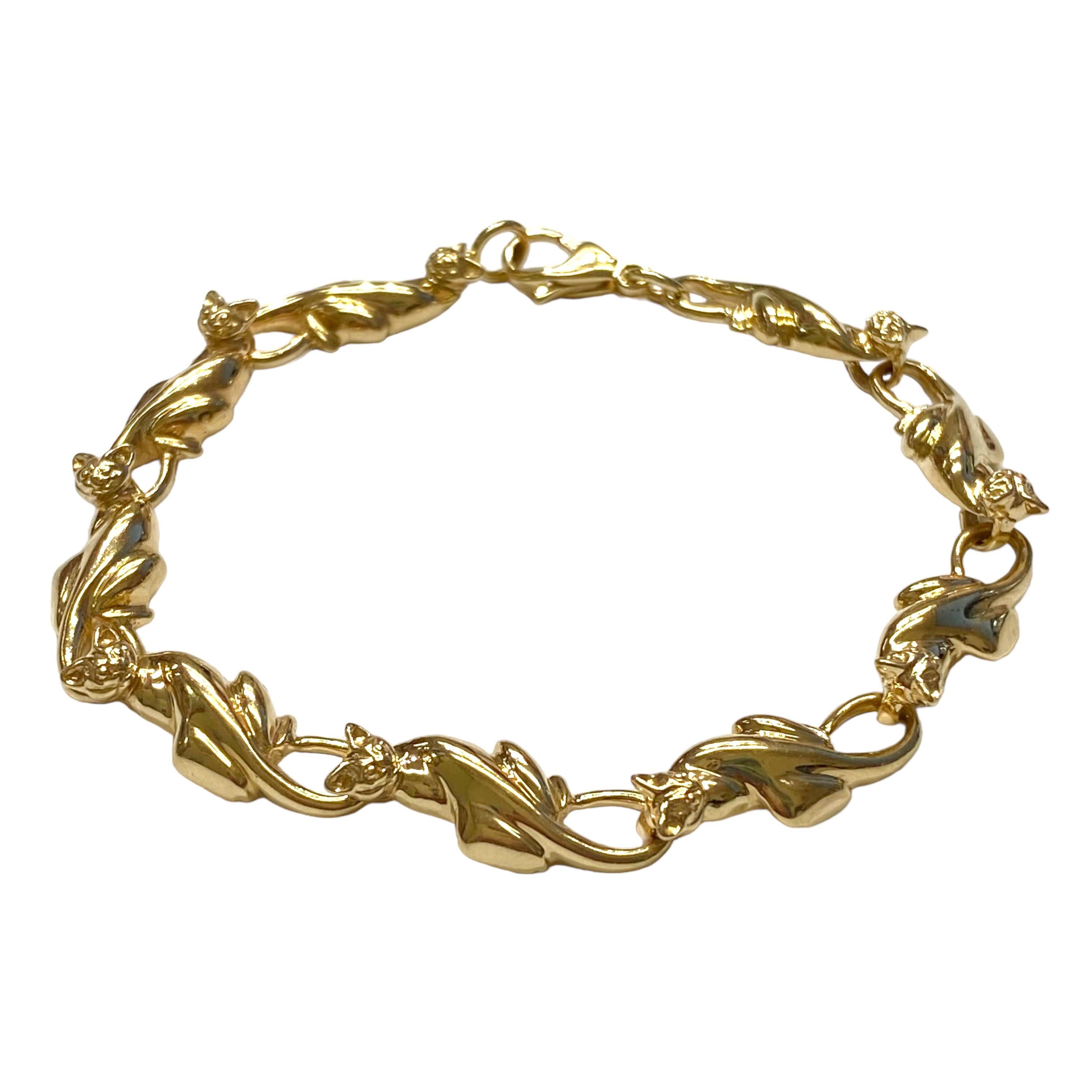 Crafted in 14K yellow gold, the bracelet is composed of a series of nine cat links.
Measurements:
Length: 7 1/2 inches
Width: 8 mm
Weight: 17.6 grams
Marked 14K TT (maker's mark)
