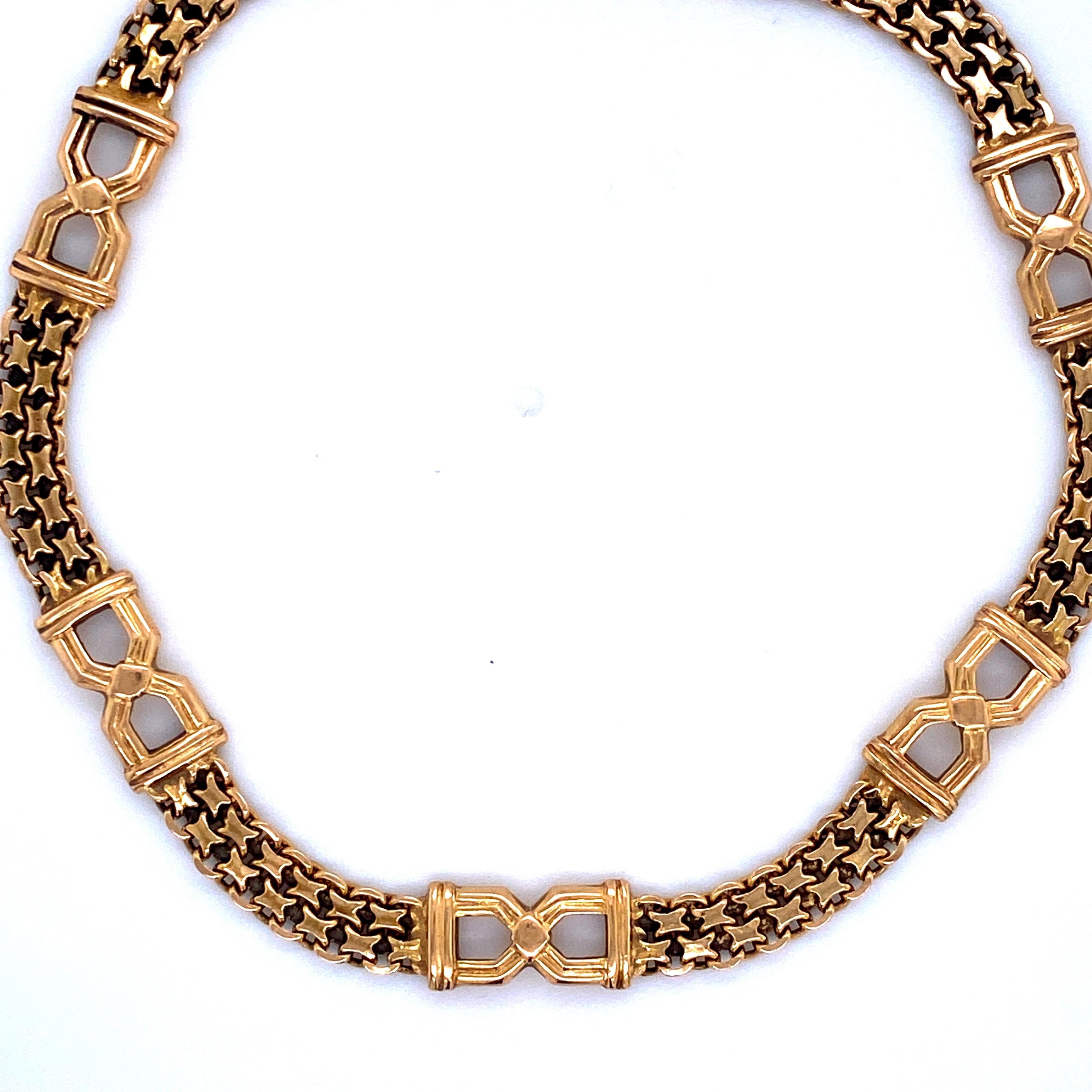 Vintage 14k yellow gold bracelet featuring two rolls of link chain with black enamel and 5 bow like links. Made in Italy 