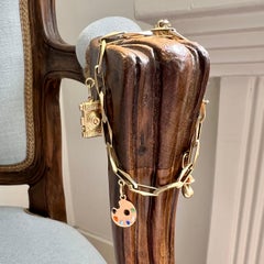 Bracelet à breloques vintage fermé à maillons en or jaune 14 carats