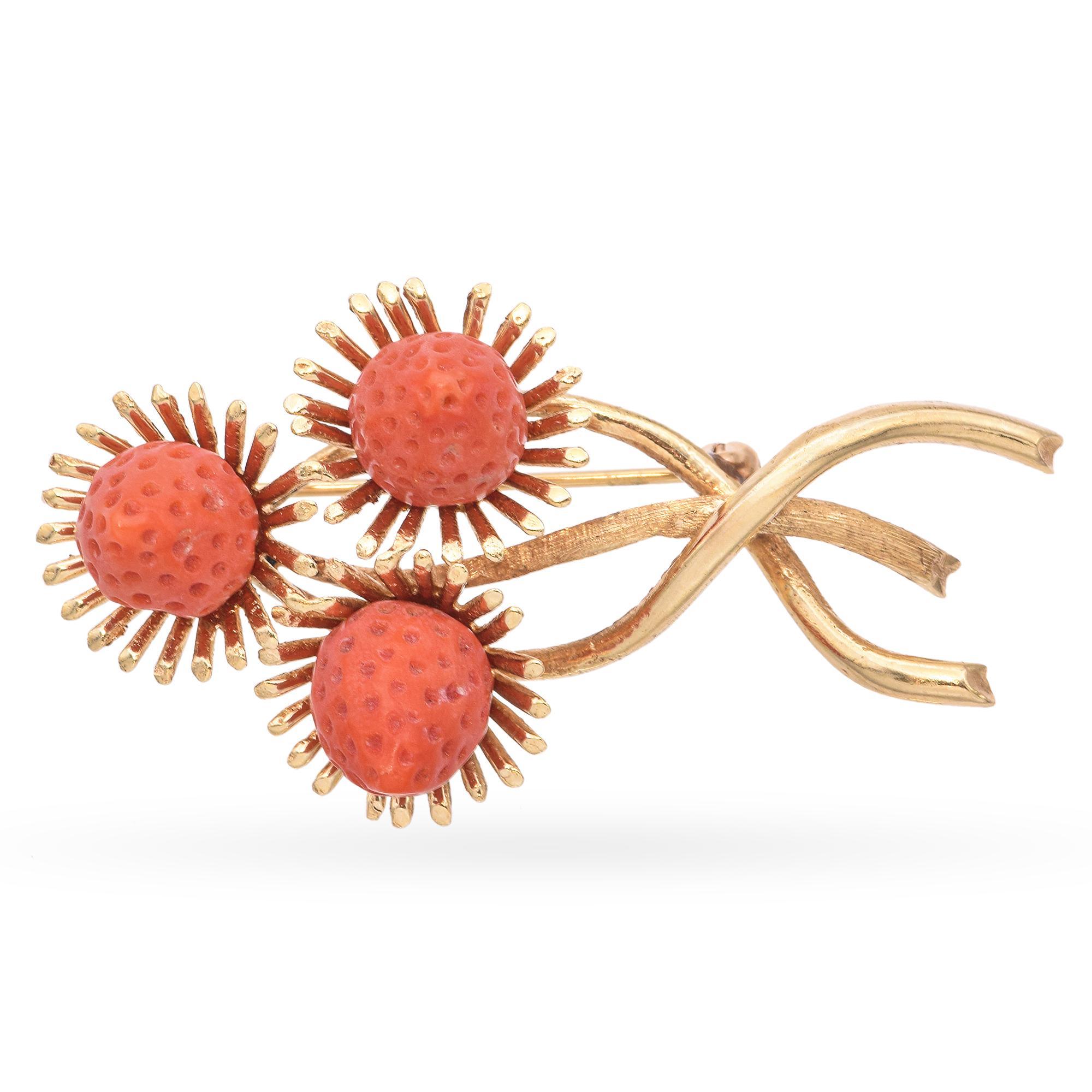 This charming vintage brooch is crafted in 14k yellow gold and features a carved coral strawberry with rich, natural texture. The coral’s warm hue contrasts beautifully with the gold leaves and stem, which are delicately detailed for added realism.