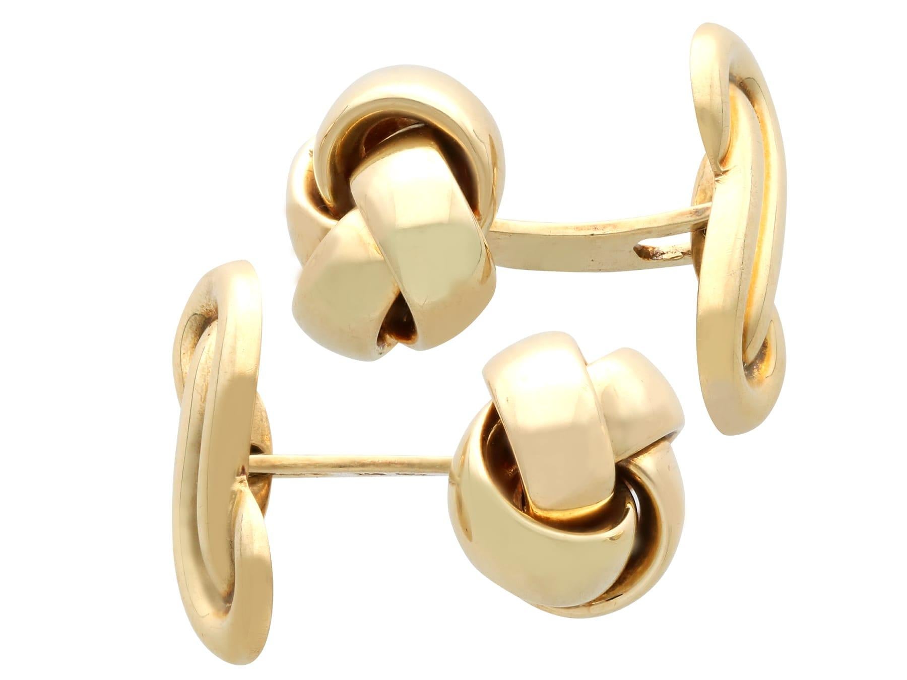 A fine and impressive pair of vintage 14 karat yellow gold knot cufflinks; an addition to our men's jewelry and vintage cufflink collection.

These authentic vintage cufflinks have been crafted in 14k yellow gold.

The anterior link of each cufflink