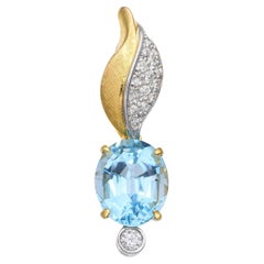 Colgante vintage de oro amarillo de 14k con diamantes y topacio azul