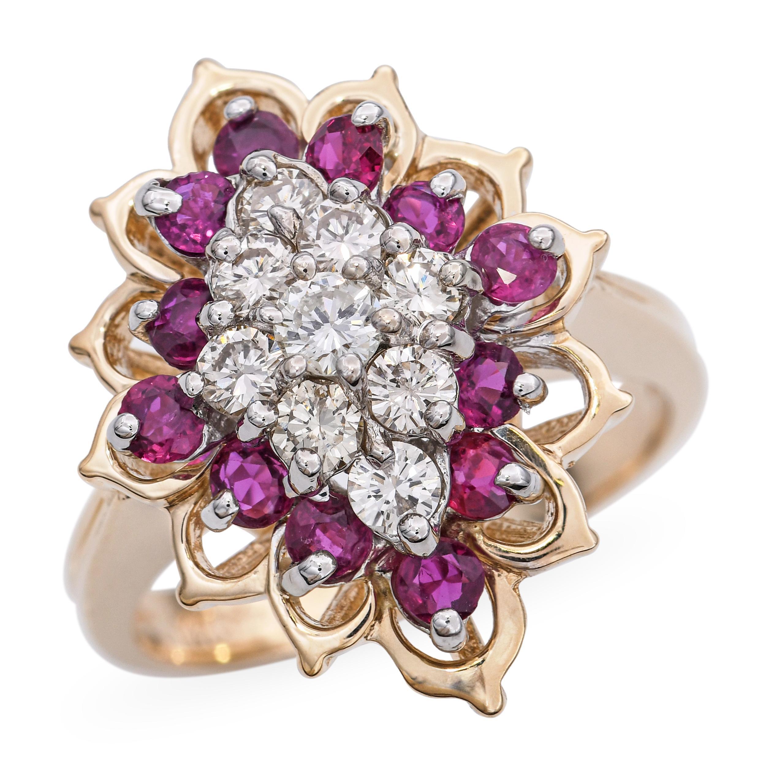 This vibrant vintage ring is crafted in 14k yellow gold and designed with a striking cluster of rubies and diamonds. The rich red rubies create a bold pop of color, while the sparkling diamonds add brilliance and contrast. The cluster arrangement