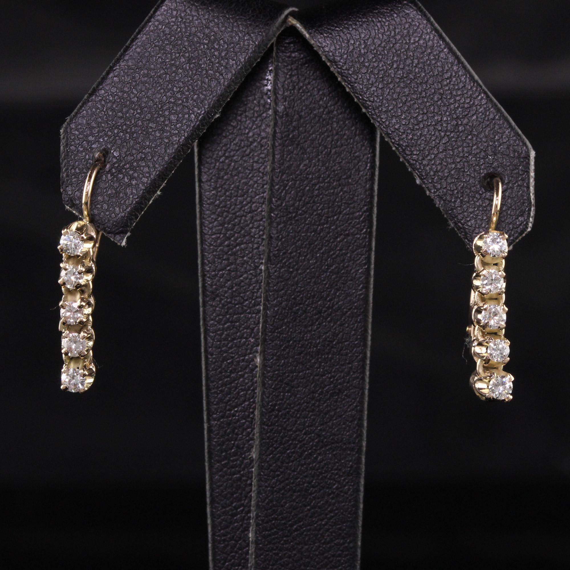 yellow gold drop diamond earrings