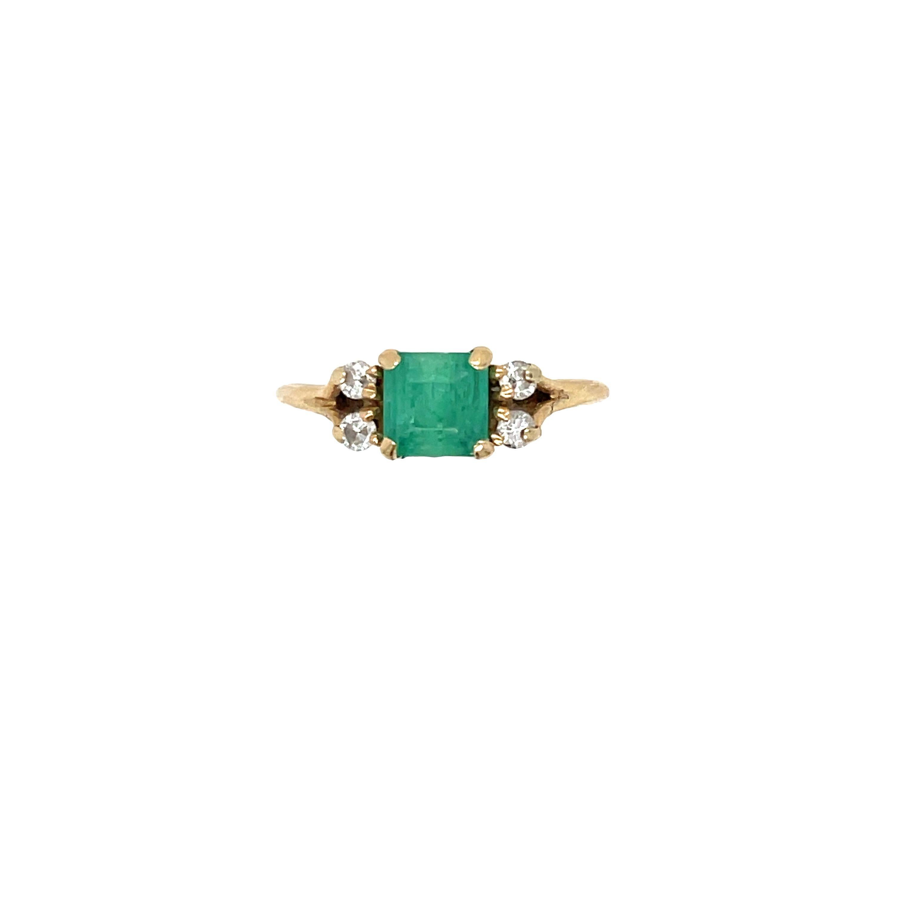 This vintage 14K yellow gold engagement ring is a true beauty with a pop of color! 

The center stone is a standout Square step-cut Emerald, measuring 5.75 x 5.75 x 3.5 mm and estimated at 0.90 carat. It truly stands out. Further enhanced with 2