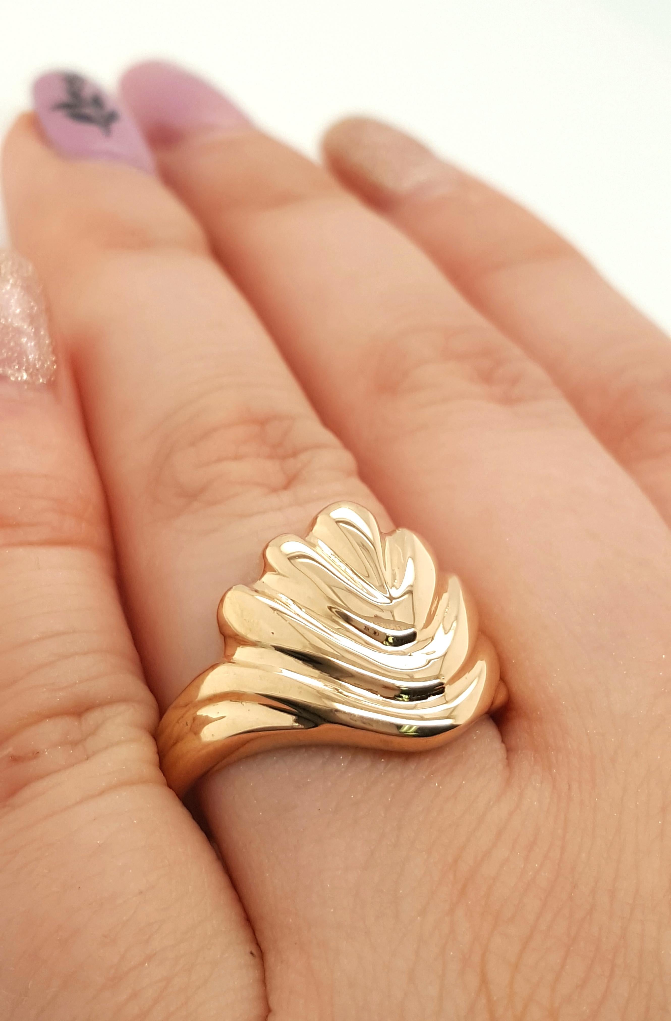 Description: 
This piece is a 14k yellow gold beauty of a fluted ring!

Item Details: 
Ring Size: 8.5
Metal Type: 14k Yellow Gold
Weight: 5.7 grams
Hallmark: 14k
Engraving: none
Width: 15.8 mm
Finger to Top of Ring Measurement: 3.4 mm
