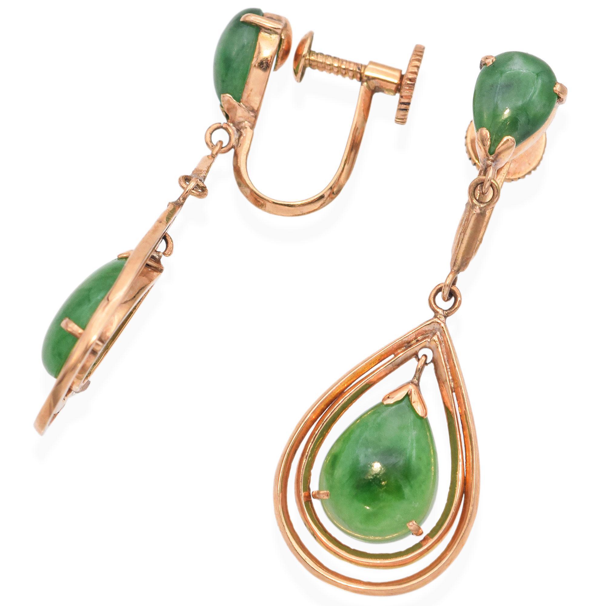 A refined pair of earrings, each crafted in 14k yellow gold, featuring jade stones of rich green hue. The design showcases a teardrop motif, elegantly suspended from a secure screw-back closure.

Weight: 5.7 Grams
Stone: Jade
Measurements: 37 x 13 x